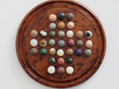 Travelling Marble Solitaire Board Game with 33 early stone Marbles, circa 1920