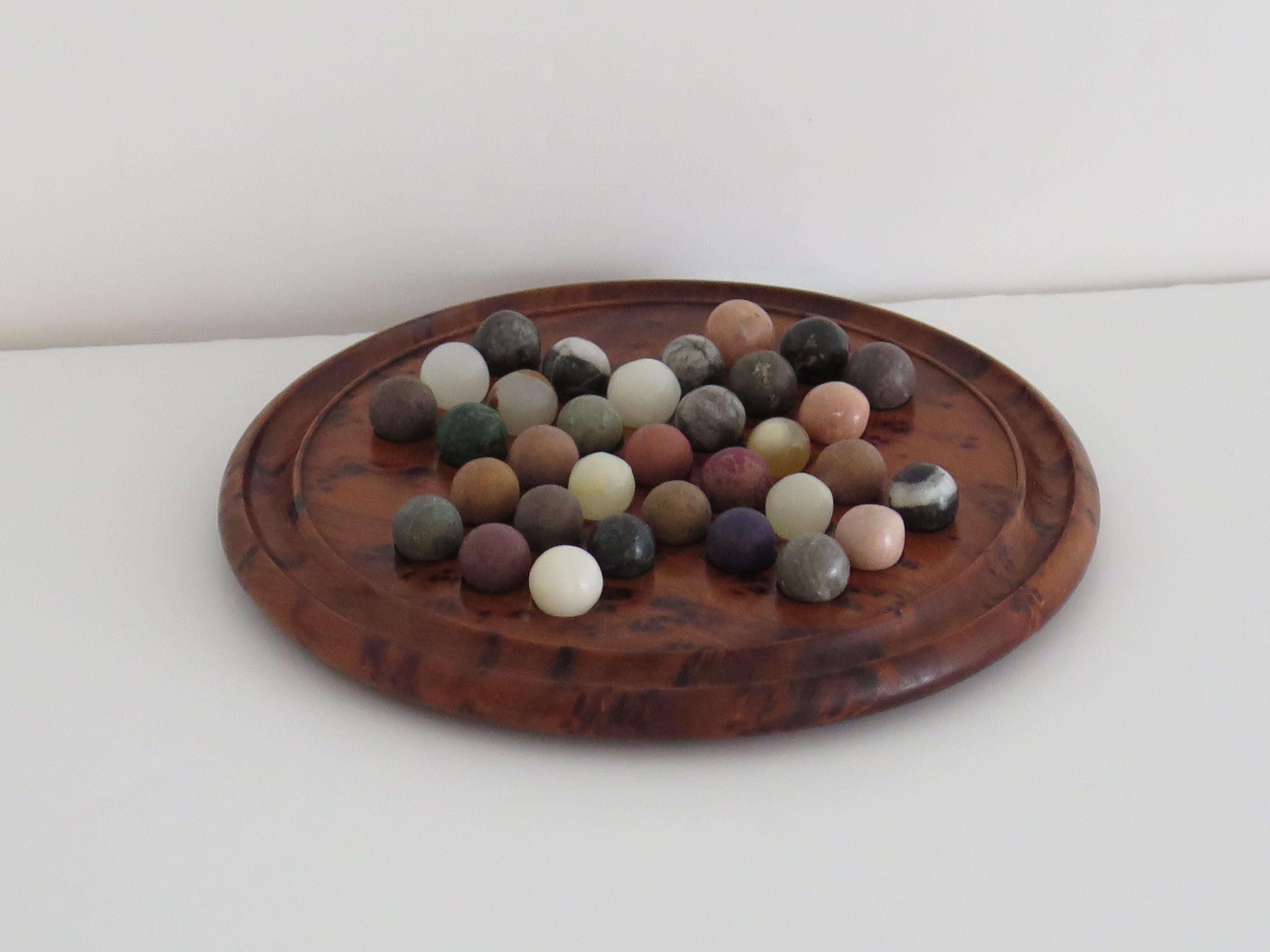 Edwardian Travelling Marble Solitaire Board Game with 33 early stone Marbles, circa 1920