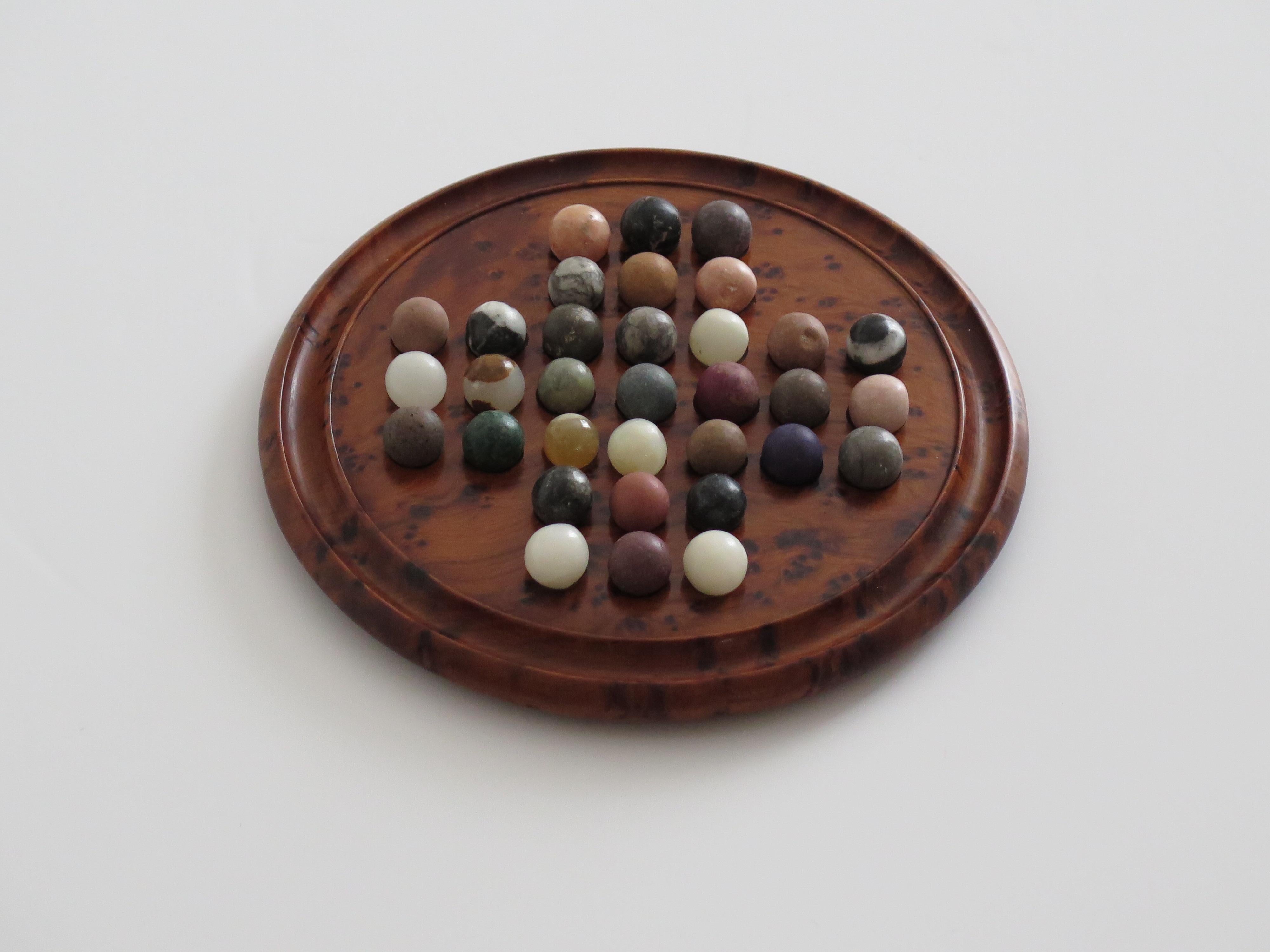 Hand-Crafted Travelling Marble Solitaire Board Game with 33 early stone Marbles, circa 1920