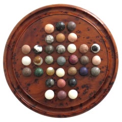 Travelling Marble Solitaire Board Game with 33 early stone Marbles, circa 1920