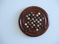 Travelling Marble Solitaire Board Game with 35 mixed stone Marbles, Circa 1930