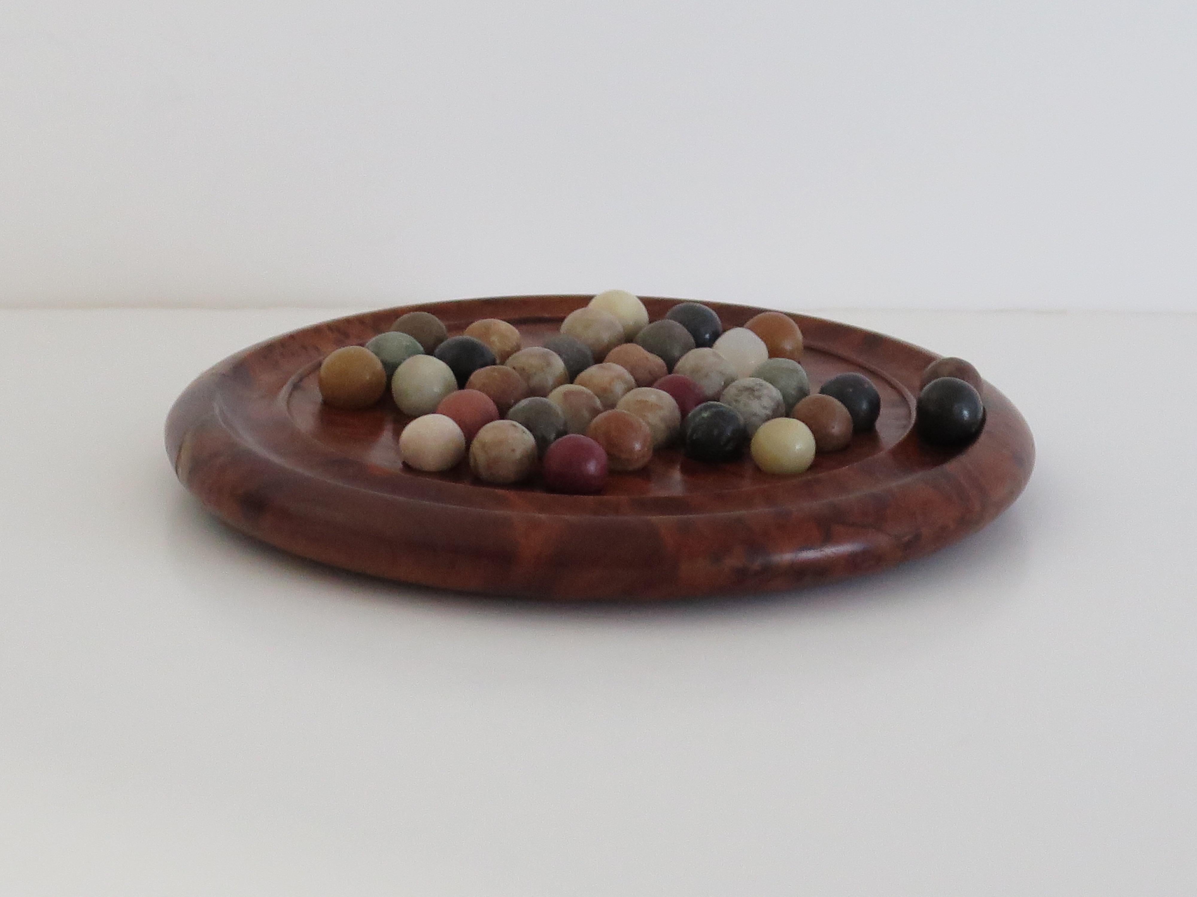 Hand-Crafted Travelling Marble Solitaire Board Game with 35 mixed stone Marbles, Circa 1930 For Sale