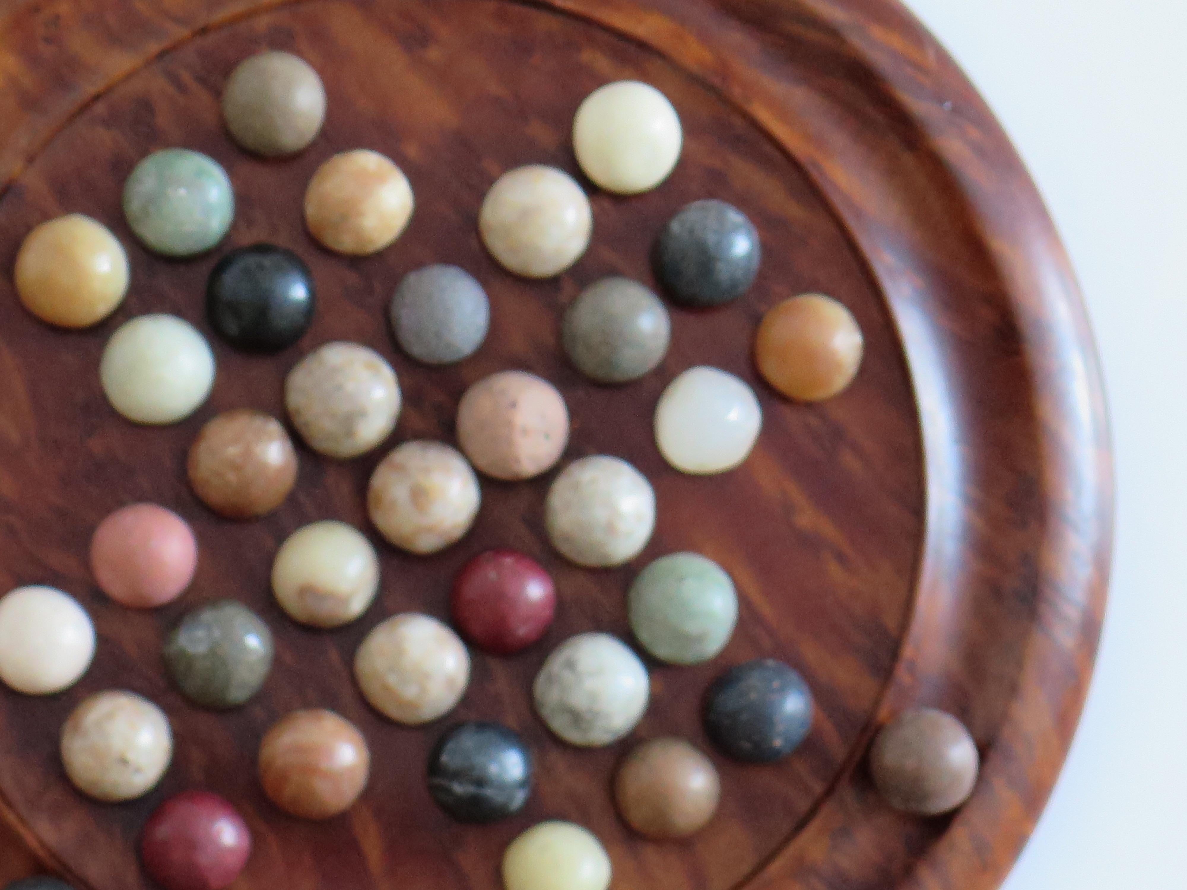 20th Century Travelling Marble Solitaire Board Game with 35 mixed stone Marbles, Circa 1930 For Sale
