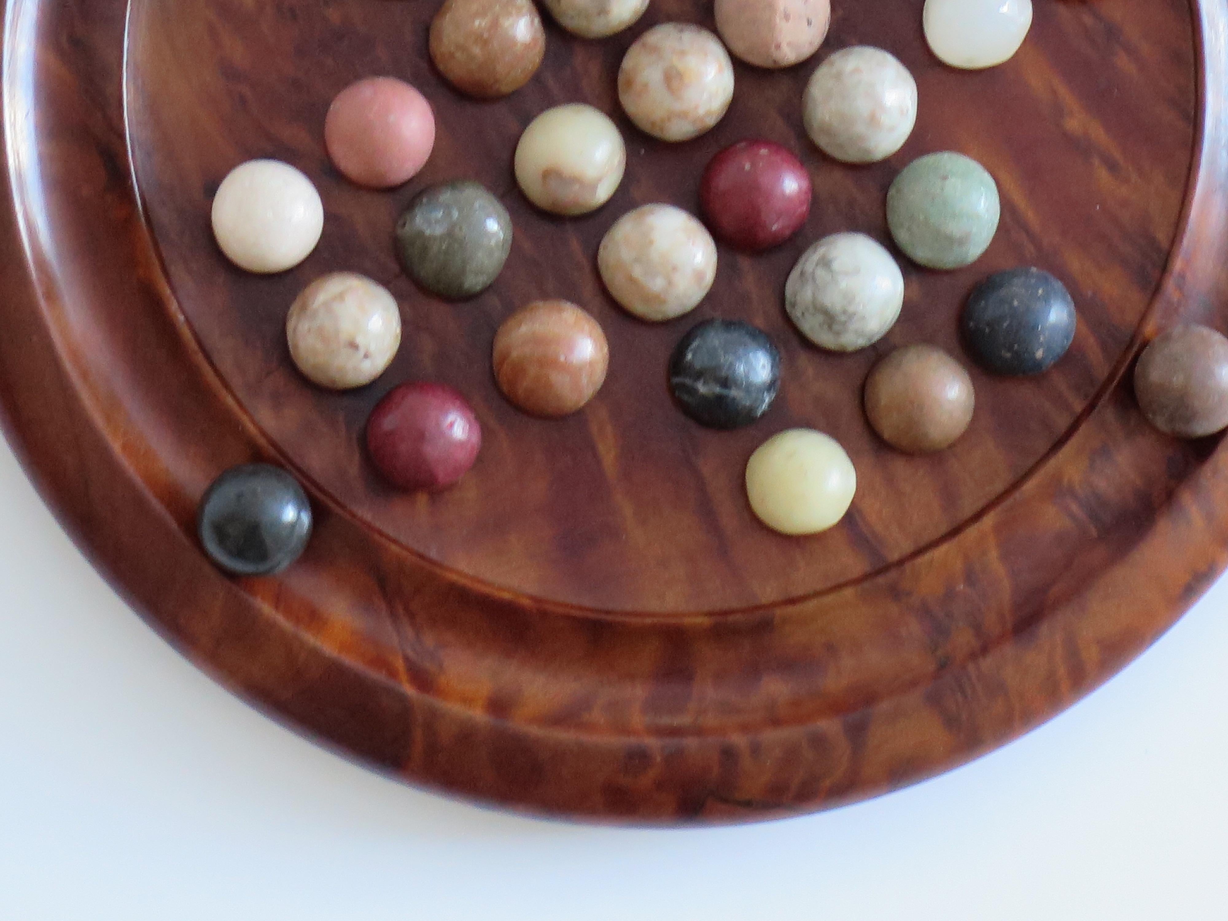 Stone Travelling Marble Solitaire Board Game with 35 mixed stone Marbles, Circa 1930 For Sale