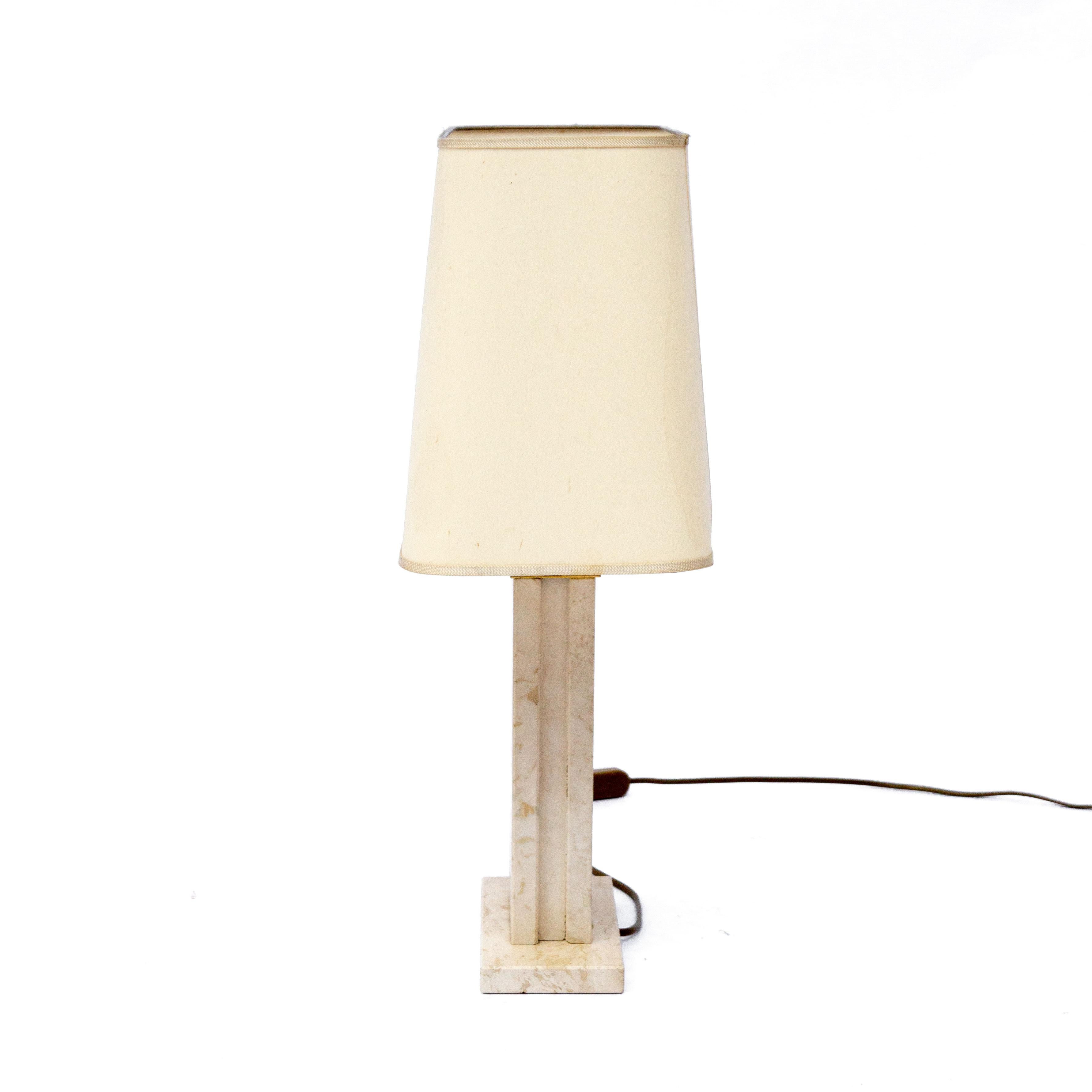 Traverine table lamp by Camille Breesch, Belgium with geometrical brass accents 1970s. The lamp features a travertine base with geometric brass details. Produced in Belgium 1970s. Designed by Camille Breesch. Shade is included. Basi is in good