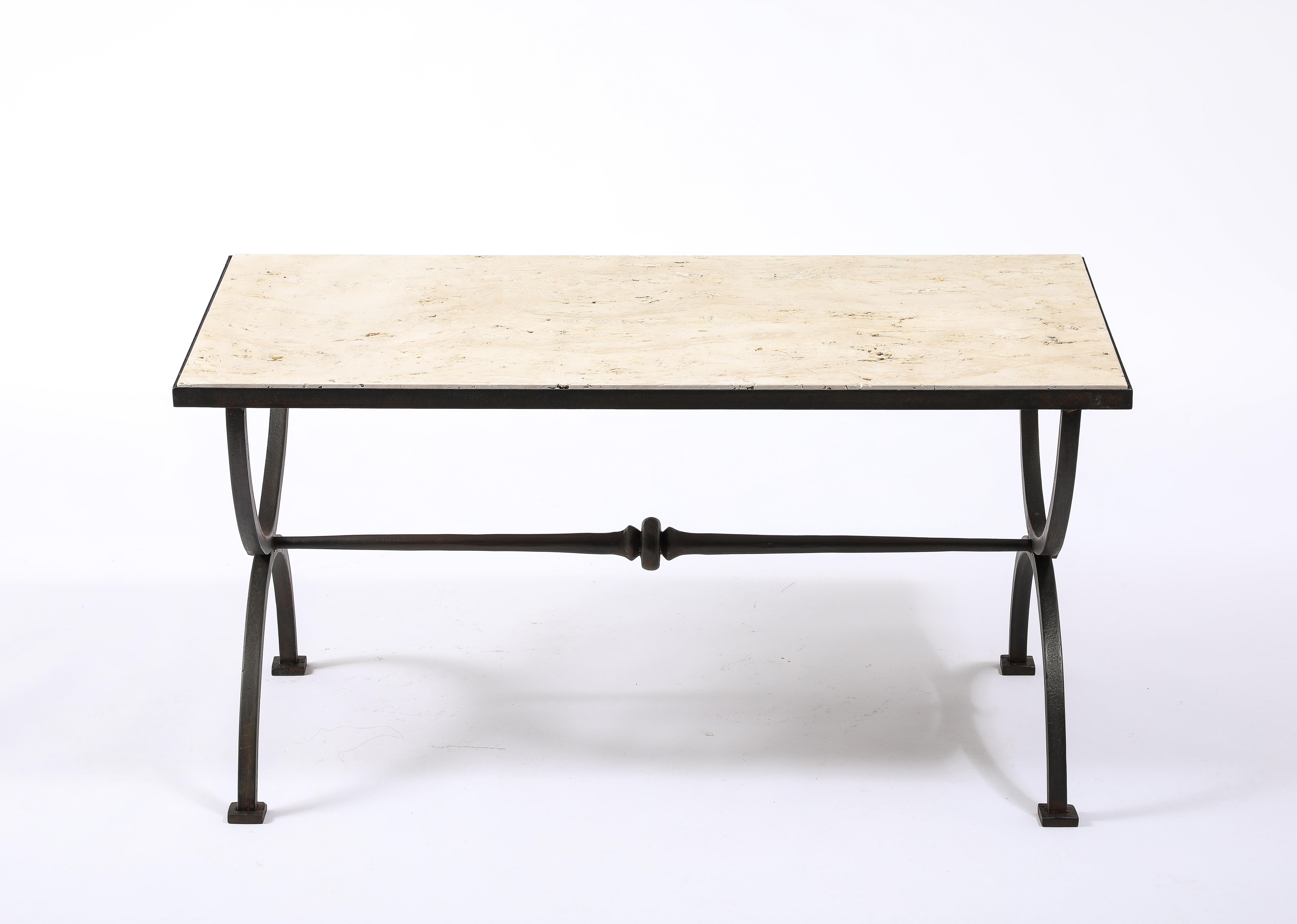 Substantial wrought iron and Travertine coffee table made of square bar with a double tapered stretcher.

