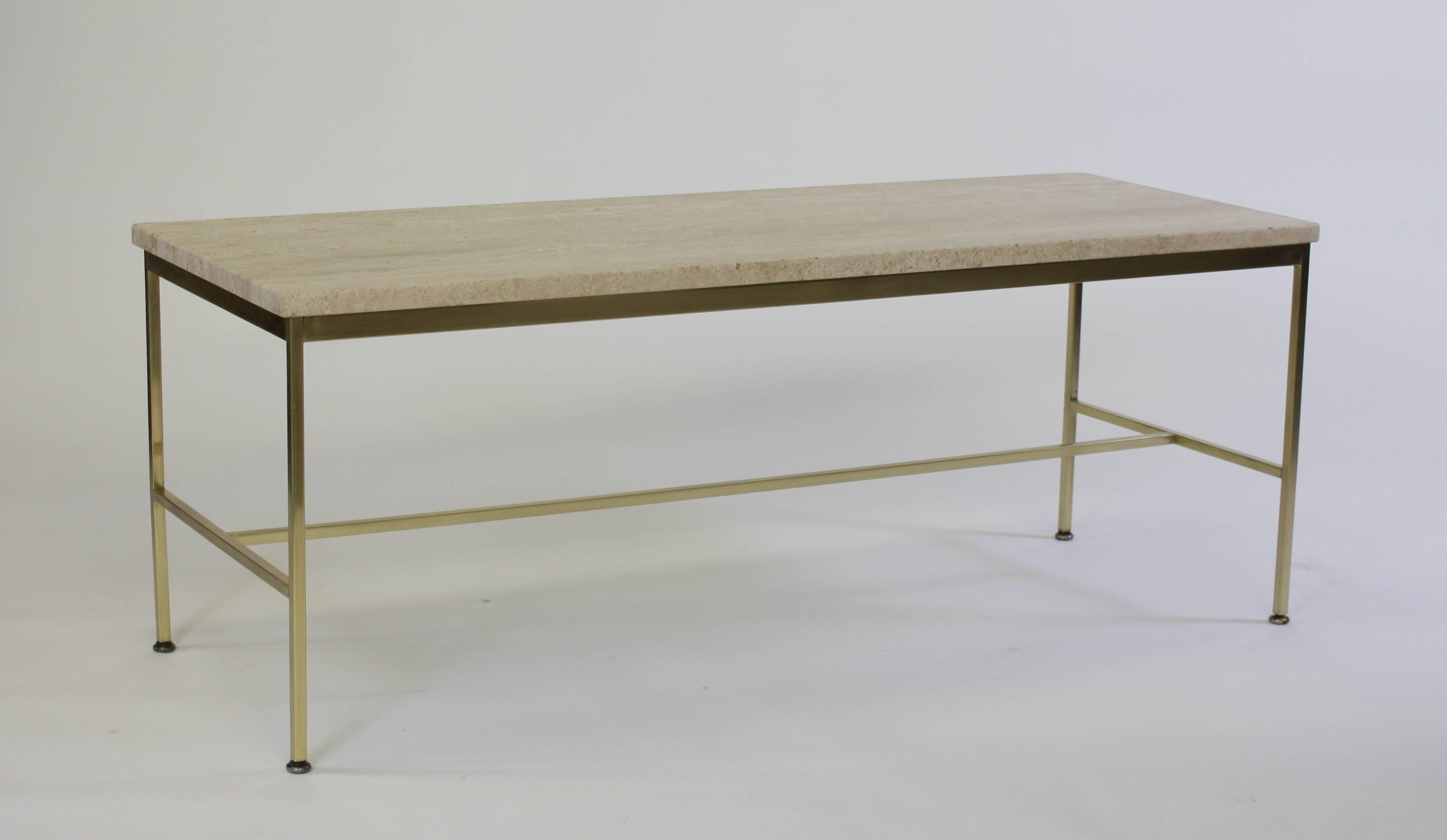 Elegant brass and travertine cocktail table designed by Paul McCobb for Calvin. One of two available from the curated collection Space 20th Century Modern.