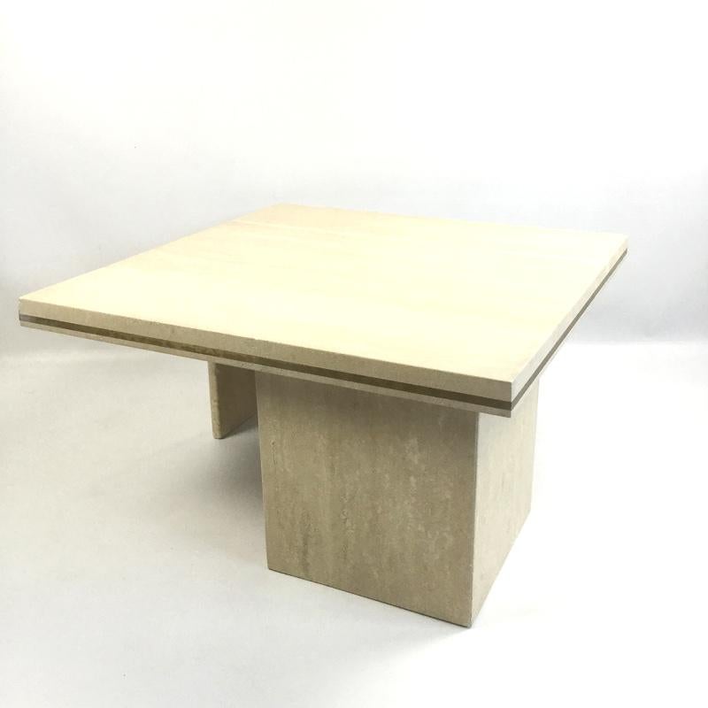 Travertine coffee table with a brass brushed line on a table edges.
 