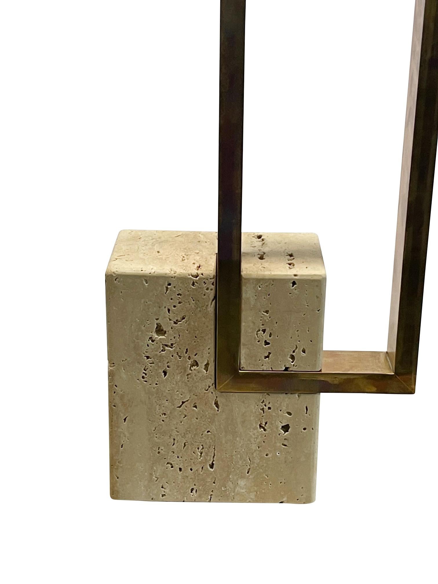 1960's Italian pair of travertine lamps with offset vertical brass rectangles.
Travertine base is unfilled and honed finish.