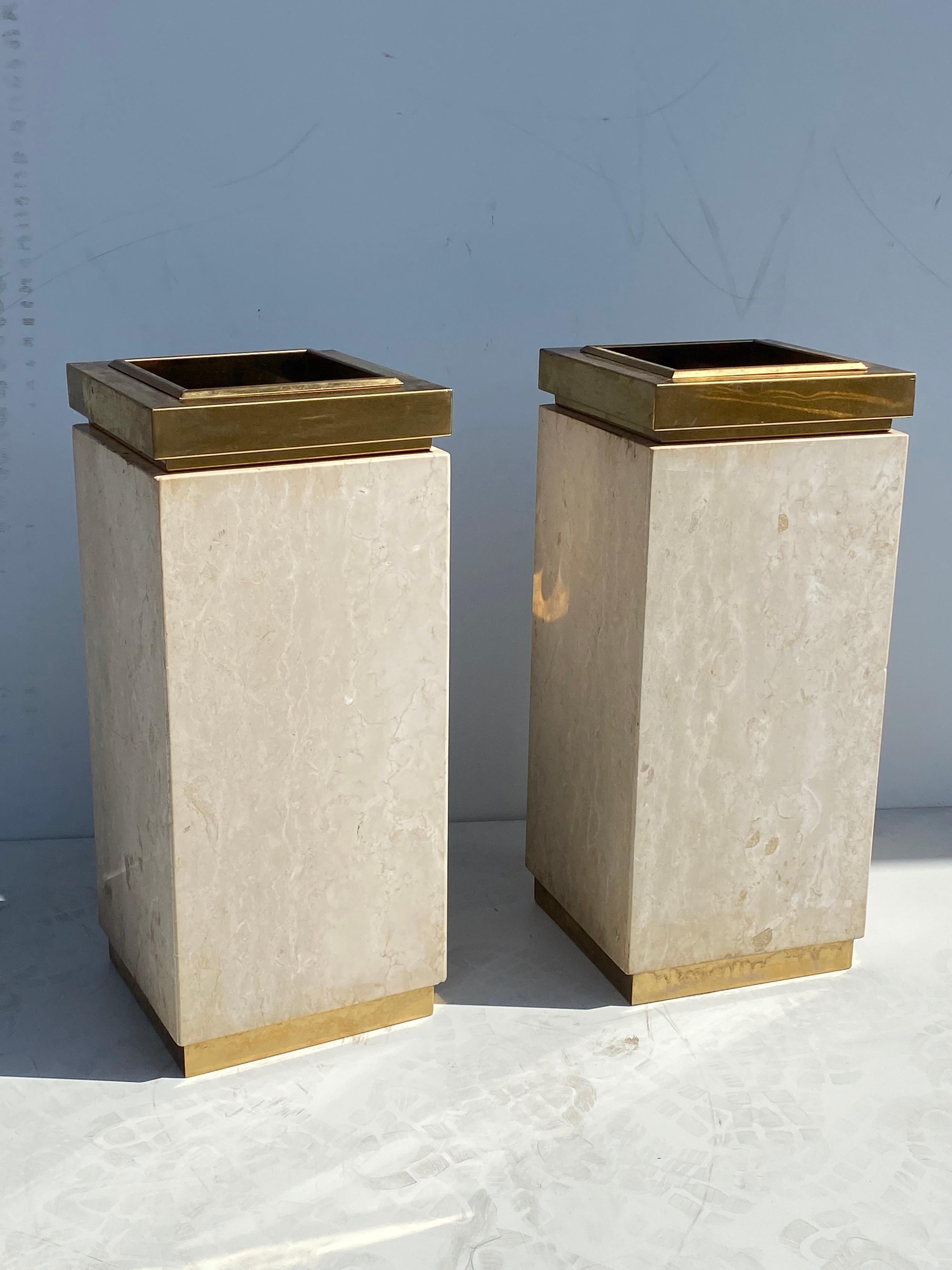 Pair of travertine and brass plated metal trash cans / planters.
Scratches on travertine and small dents and age spots on metal.