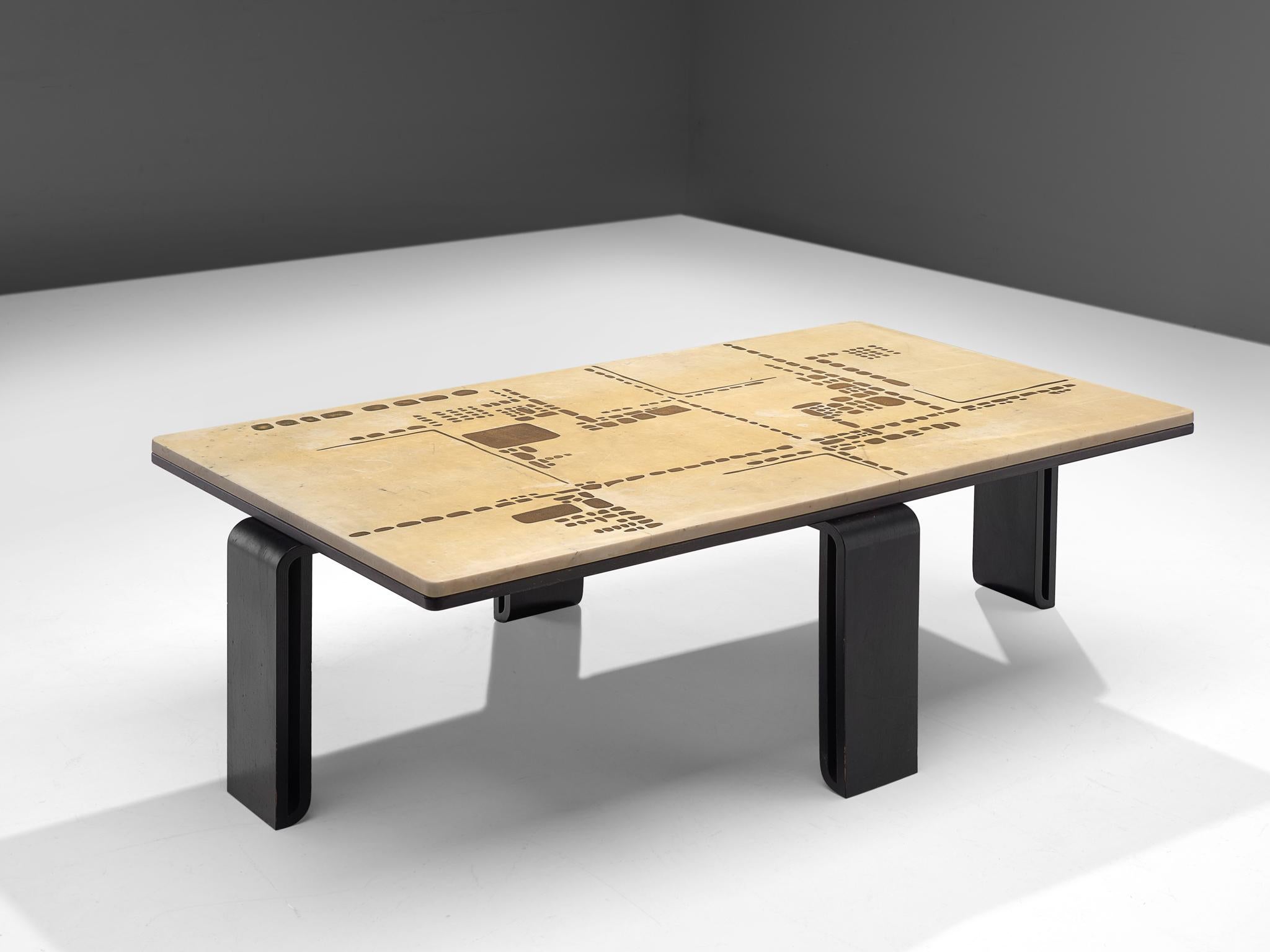 Coffee table, travertine, ebonized wood and concrete, the Netherlands, 1980s. 

Abstract design of marble table top, inlayed with concrete, creating a beautiful pattern. The frame is executed in blackened wood and features sculptural legs. Overall