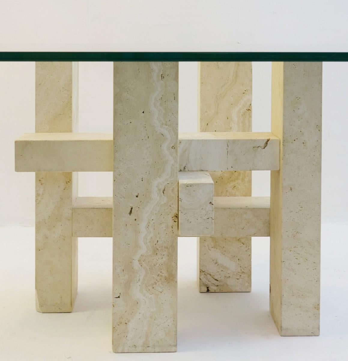 Travertine and glass dining table.