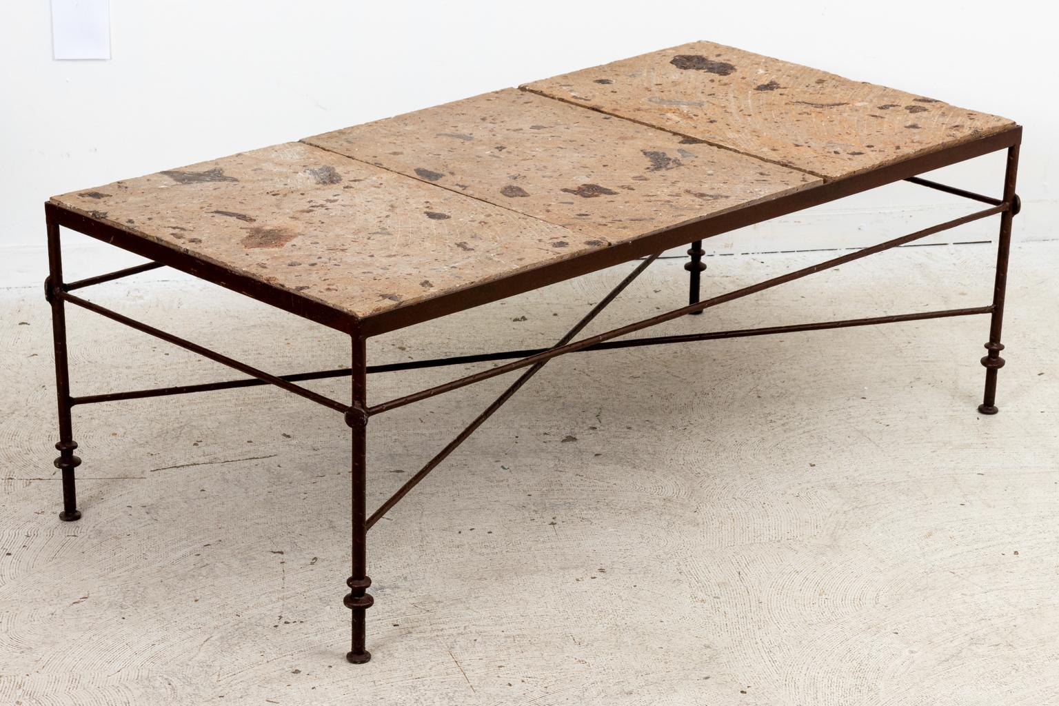 Circa 1980s iron frame coffee table with travertine stone tabletop. The base also features ring turned detail and an x-shaped cross stretcher. Please note of wear consistent with age.