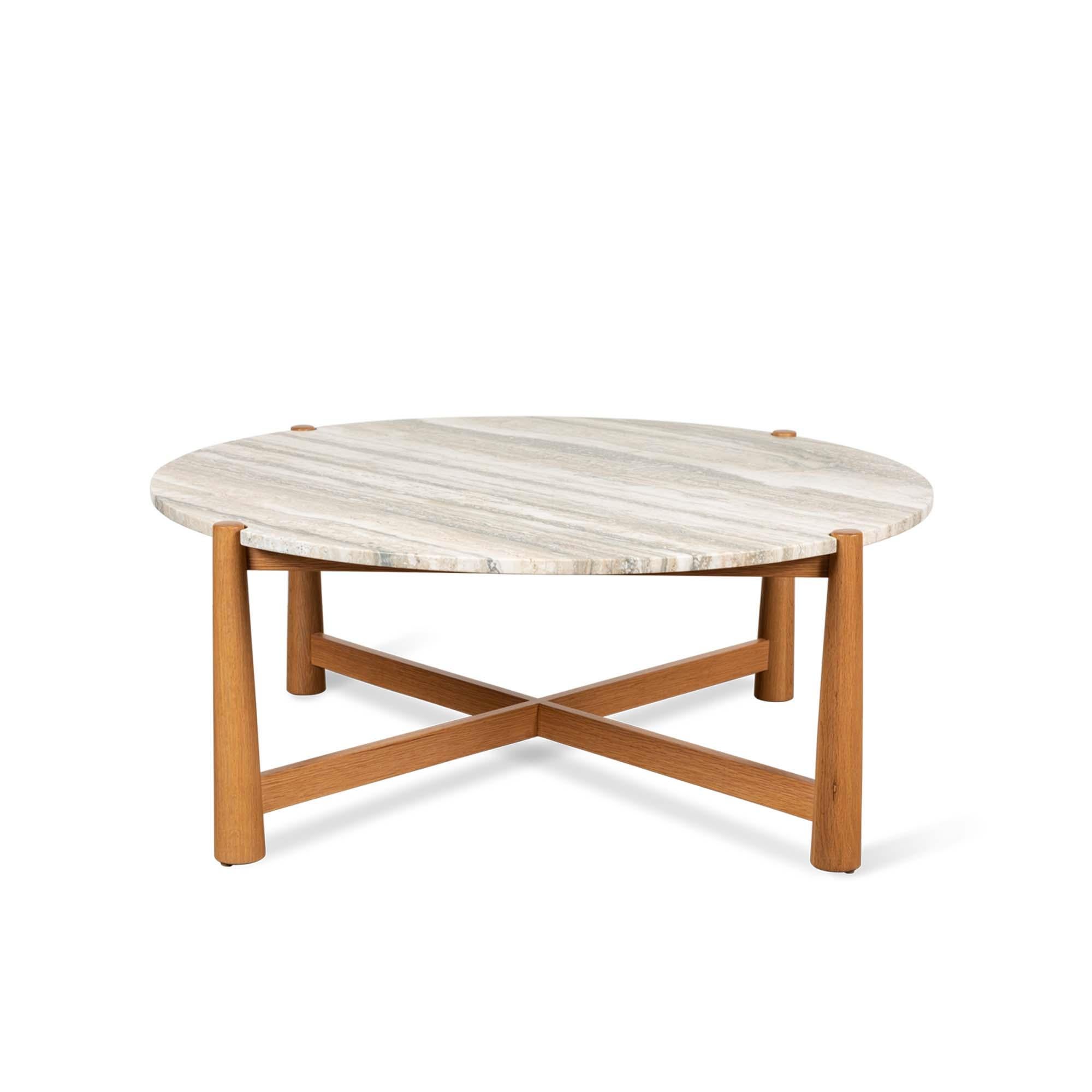 Travertine and oak round Bronson coffee table by Lawson-Fenning. The Bronson coffee table features a stone top with notched corners that rests atop a detailed American walnut or white oak base.
Measure: 42