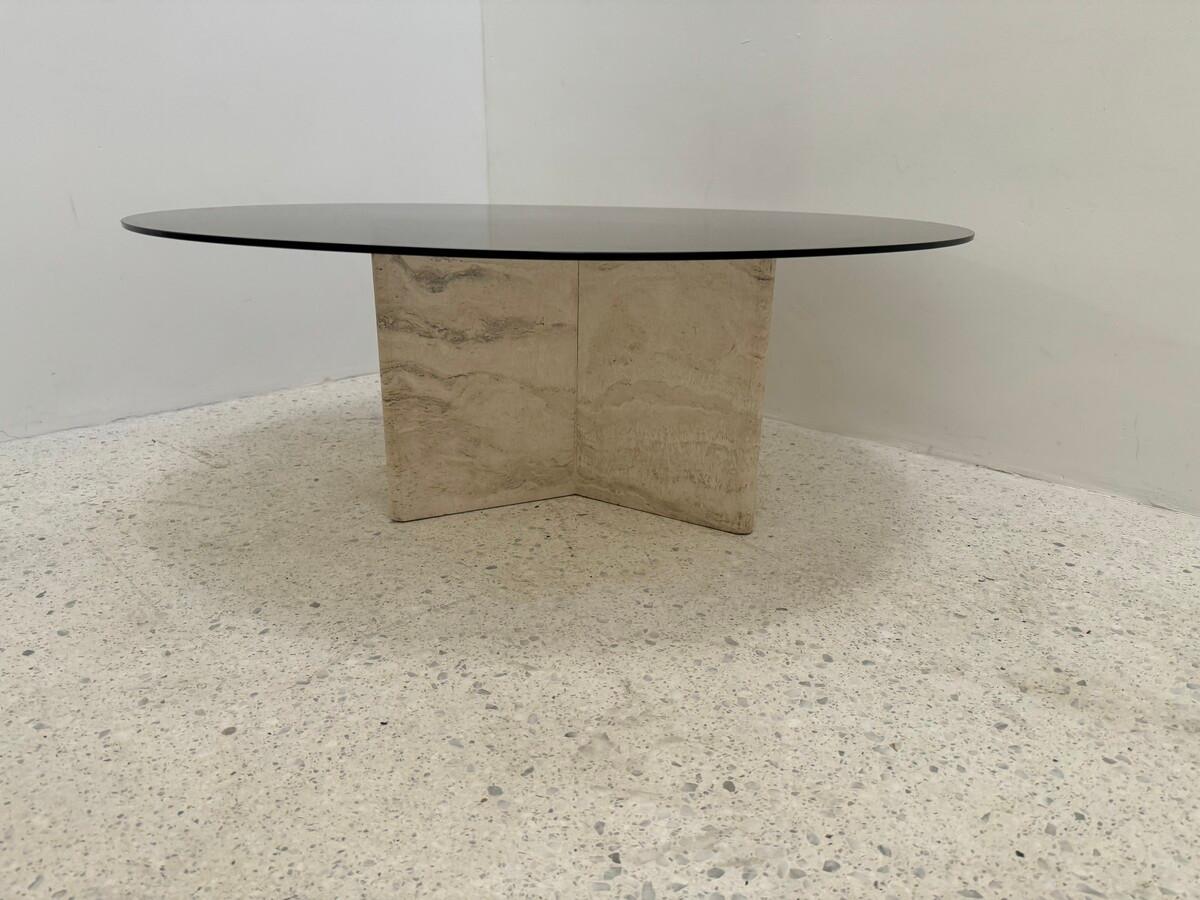 Travertine coffee table with smoked glass top. Italy, 1980s.