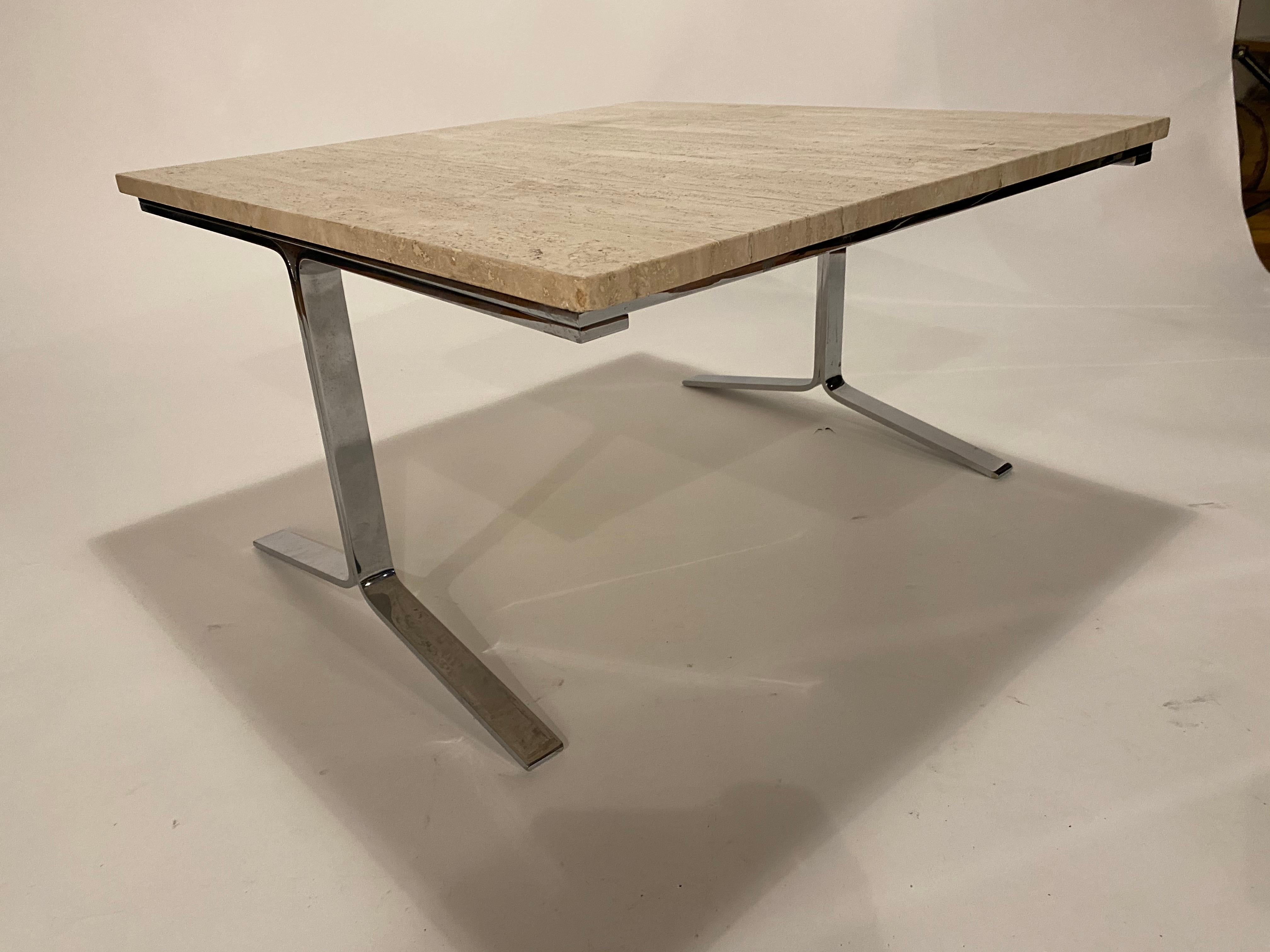 Square cocktail or end table made of polished chrome steel frame and travertine top.