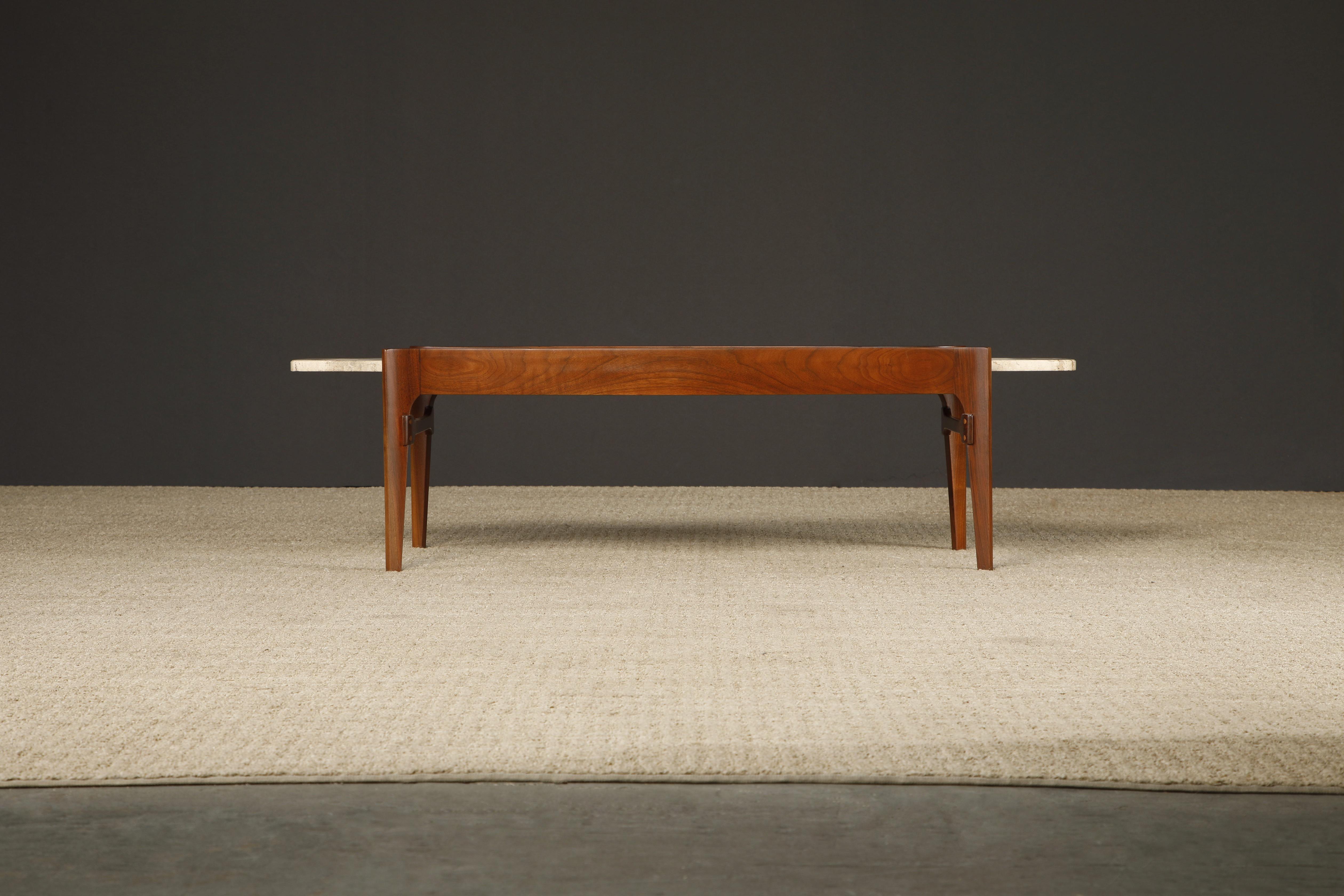 Discover timeless elegance with this exceptional refinished Walnut and Travertine coffee table from Gordon Furniture Co., crafted in the United States during the 1950s. This coffee table combines the best of Scandinavian and Italian modern design,
