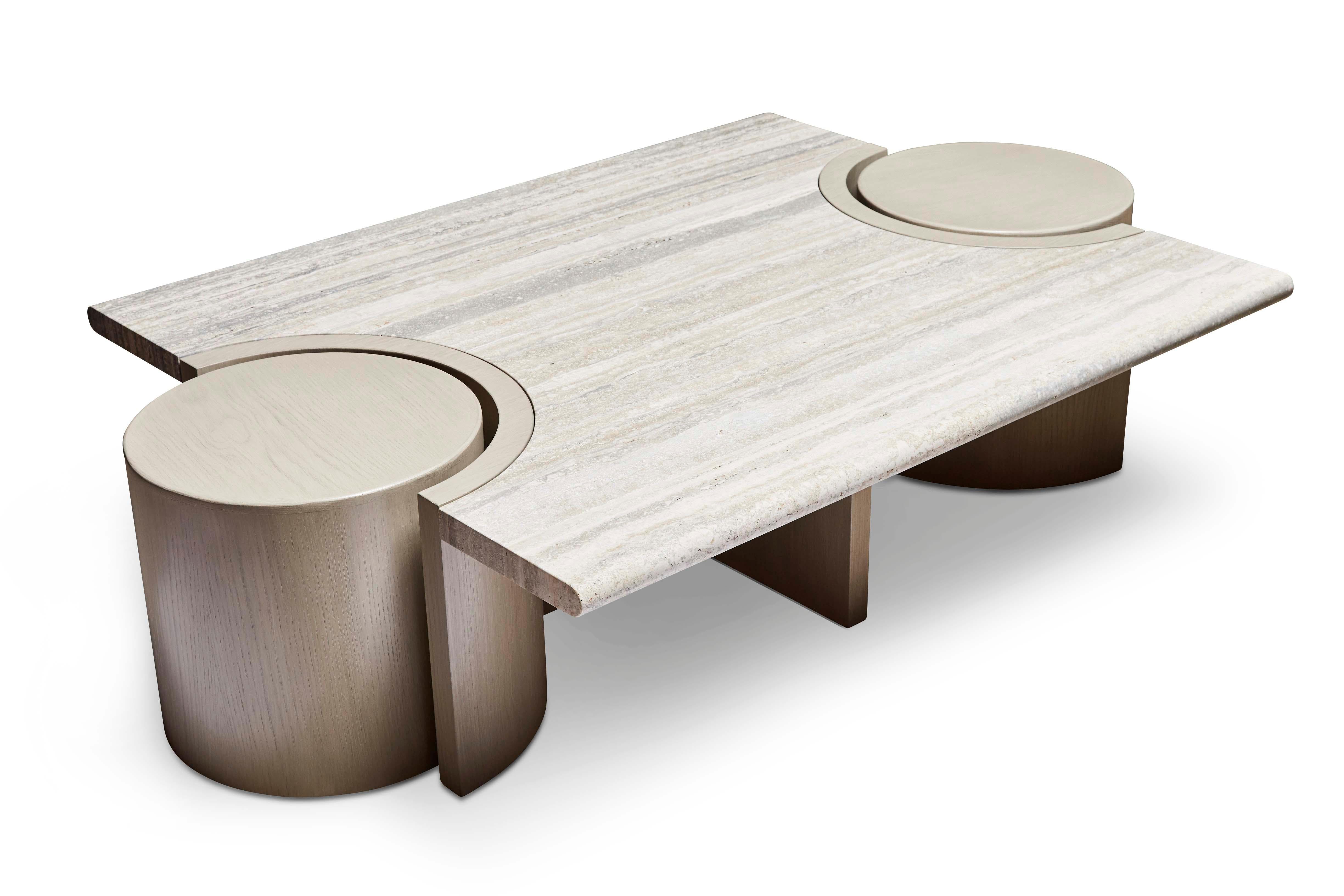 The prospect coffee table features a stone top that rests atop a sculpted American walnut or white oak base with two cutouts for drum tables on either end. 

The Lawson-Fenning Collection is designed and handmade in Los Angeles, California. Reach
