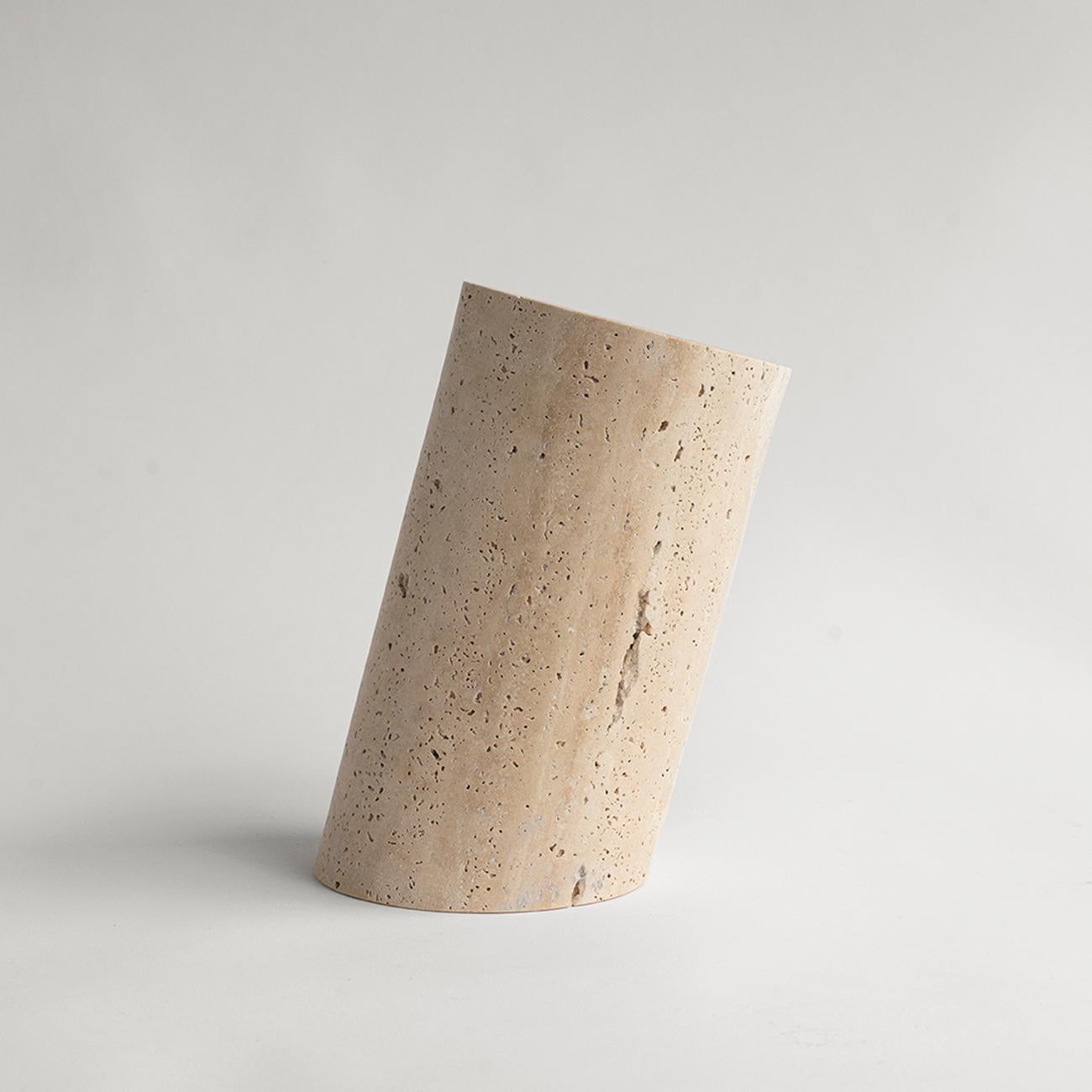 This travertine angled wine cooler is designed by us and hand crafted by the artisans within the fair-trade principles.

The natural properties of travertine will keep your wine chilled with no need for ice - you can also place this marble cooler