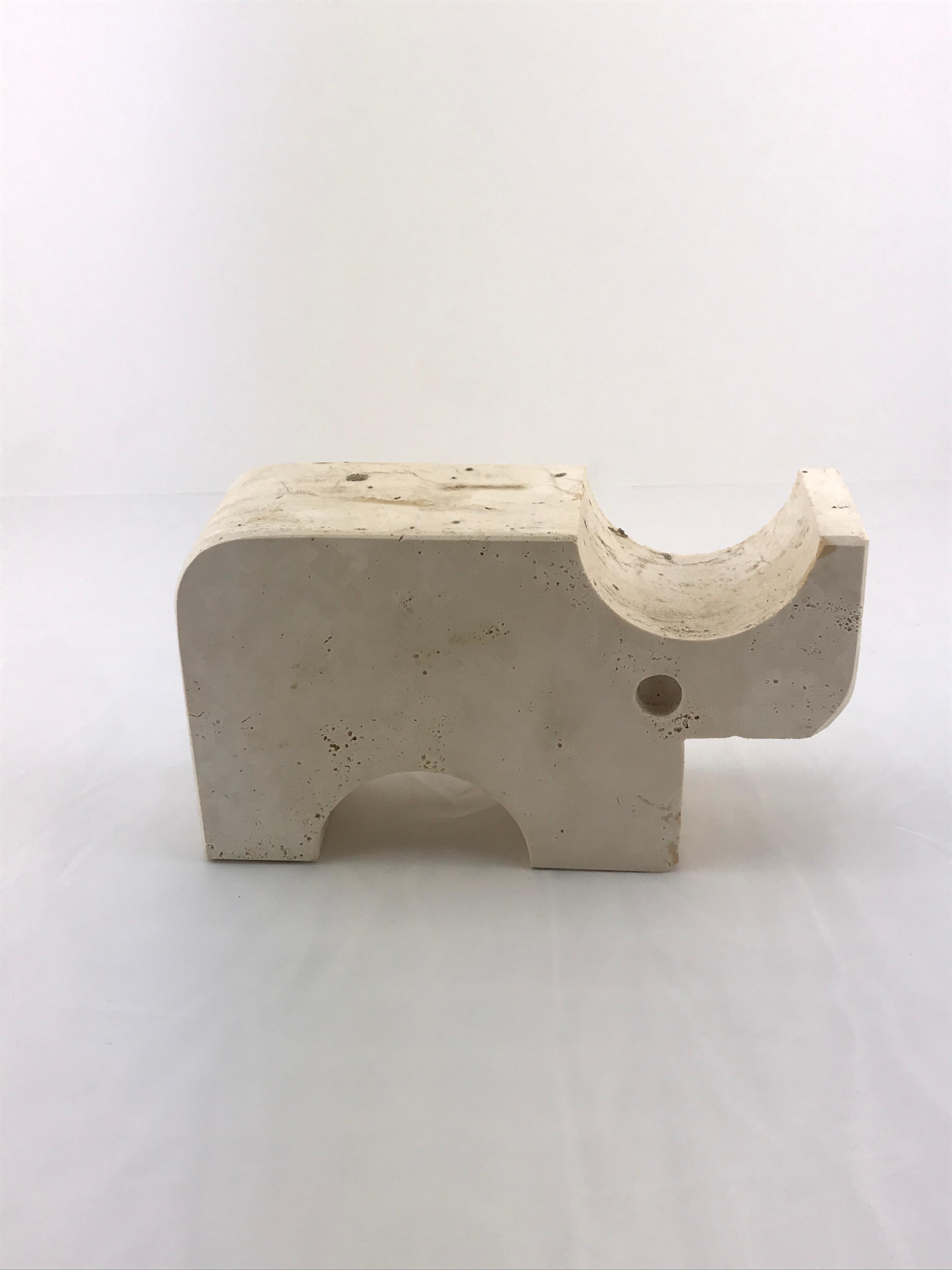 Travertine elephant table sculpture by Mannelli Bros., Florence, Italy (circa 1970s). Joyful travertine stylised Rhino will delight art lovers and collectors. Minimalist in style with soft curves and lines, this sculptures may be displayed as a work