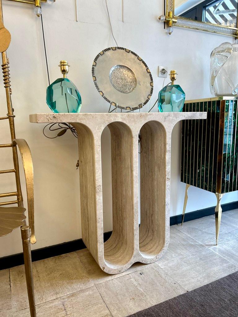 Exceptional quality for this console carved from one piece in a large block of travertine..