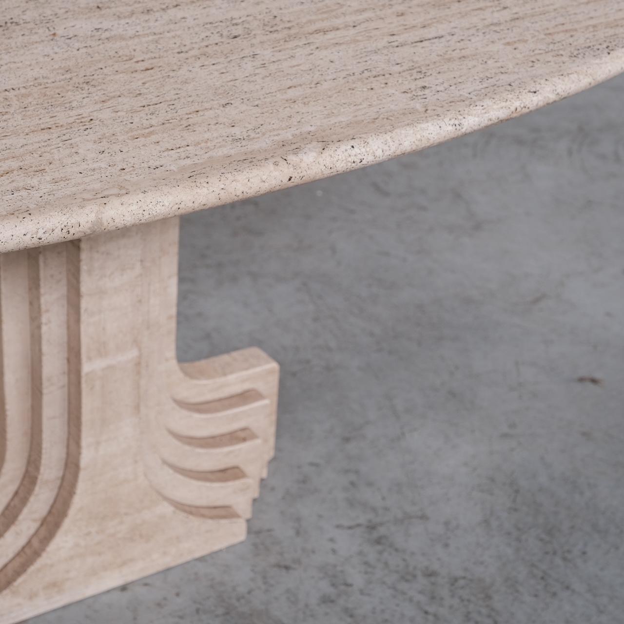A travertine dining table. 

Attributed to Carlo Scarpa as the 'Argo' table. 

Italy, c1975. 

With heavy architectural influence. All in solid travertine. 

Generally good condition, one small chip to the base, wear commensurate with age.