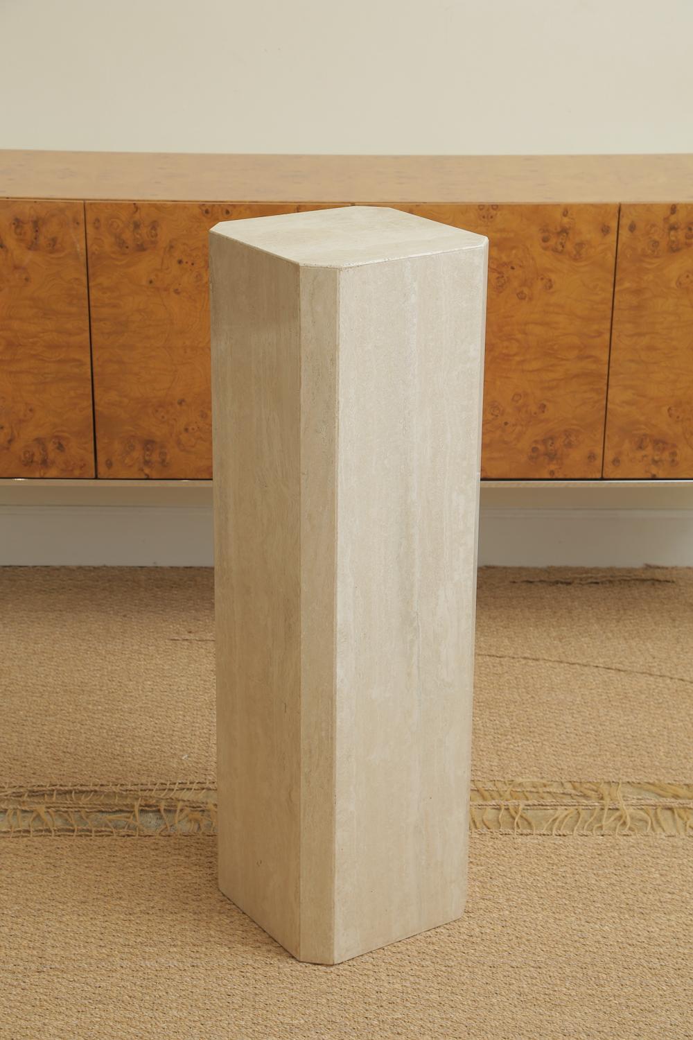 This travertine pedestal column from the 1980s is great for placement of a work of art or sculpture. This was part of a 2 part sculpture by a noted Japanese artist named Kiku. The stone torso got sold separately. This will fit beautifully in a