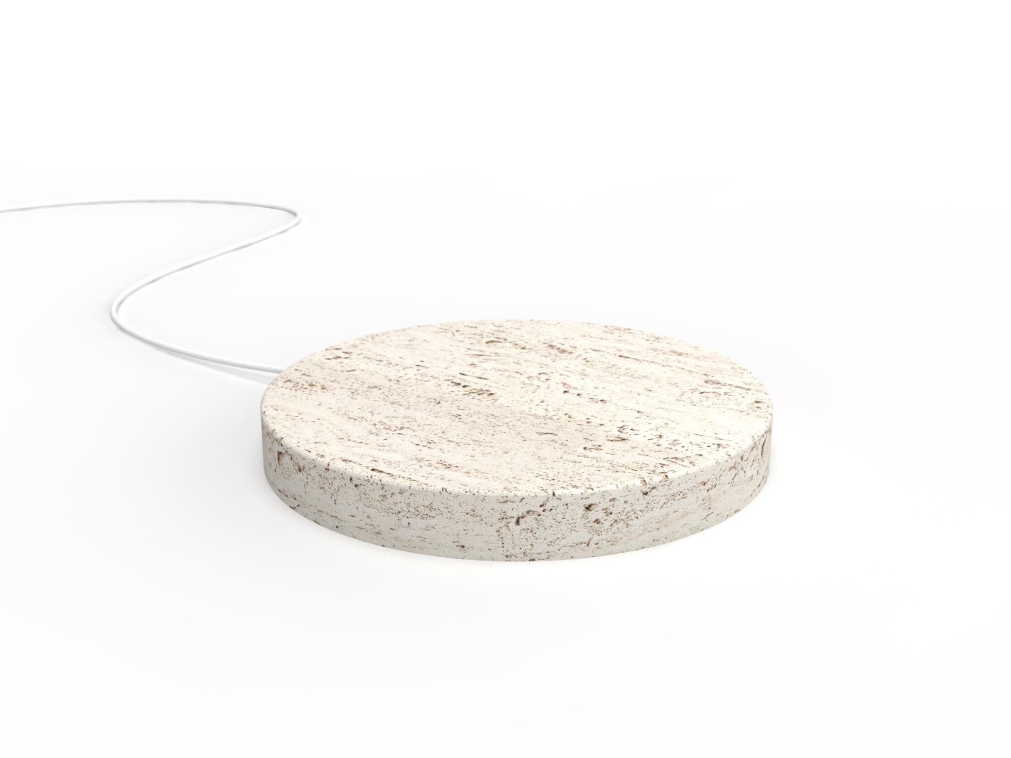 A travertine base,
that quickly charge your phone, with a touch of magic.
 
A circle,
a stone,
realized with the care that stone requires.

A powerful wireless charging technology ensures an efficient and reliable power delivery.

The result is a