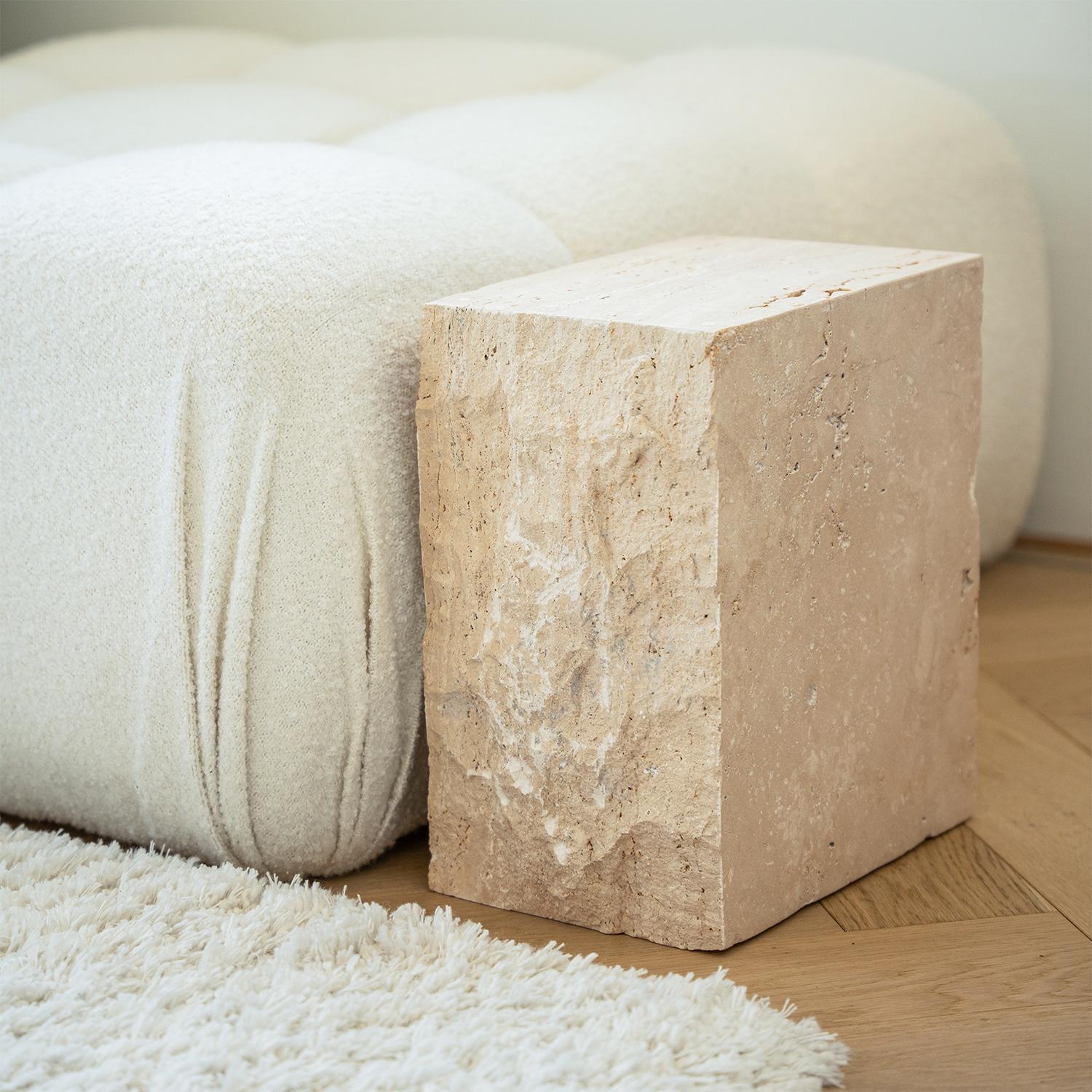 This travertine block side table brings the beauty of natural stone into your space. Made from solid travertine, its organic texture and neutral tones complement a variety of interiors.

Multiple Uses:

✔ Side Table: A functional addition next to a