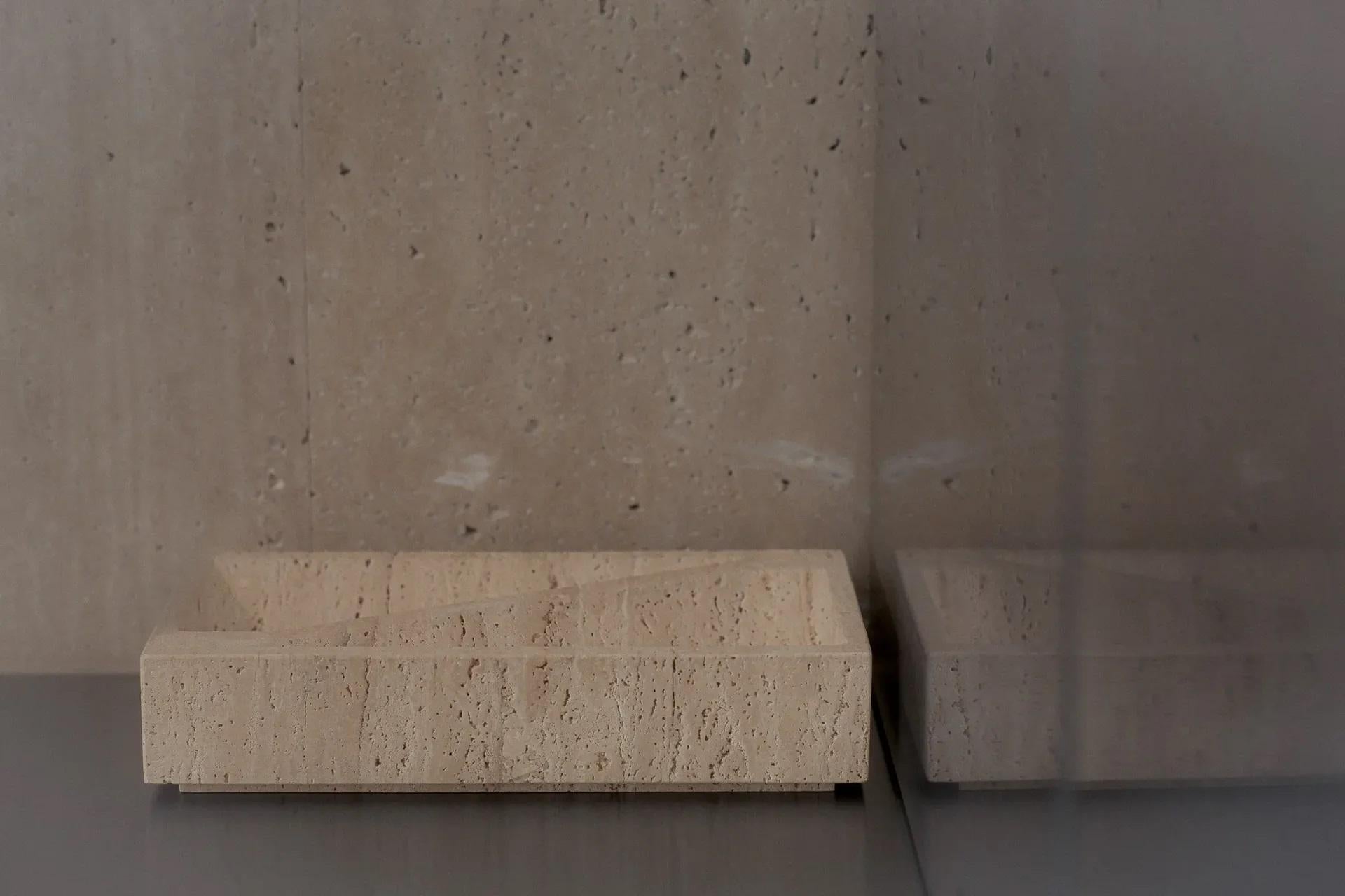 Travertine Block Tray by Henry Wilson
Limited Edition of 50
Dimensions. W 30 x D 18 x H 7 cm
Materials: Classico travertine.

Available in Classico travertine and Persian Brown marble.

Block Tray is a limited edition of fifty pieces inspired by