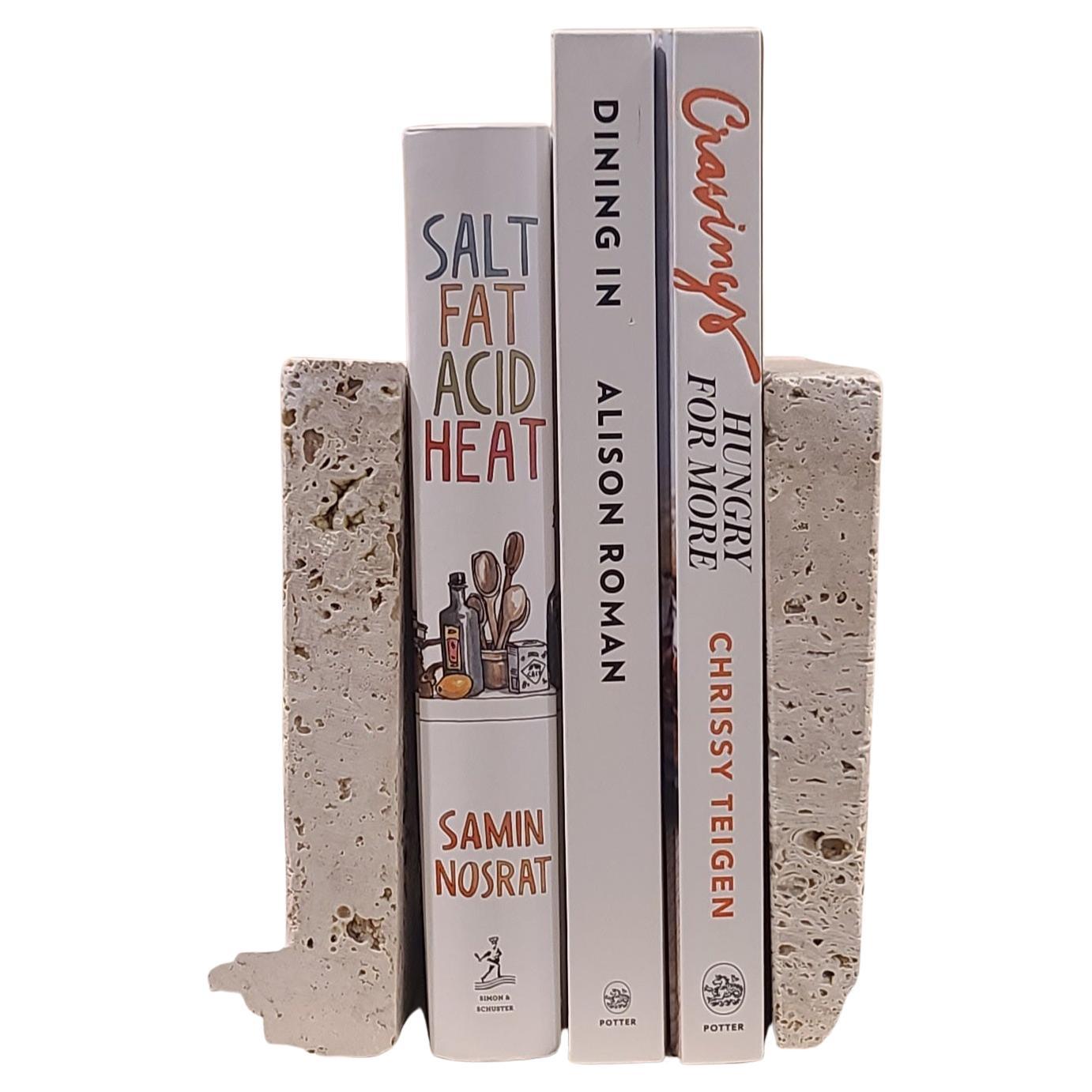 Travertine bookends are elegant and functional accessories for organizing and displaying books. Crafted from natural travertine stone, these bookends often feature unique patterns and earthy tones, adding a touch of sophistication to any bookshelf