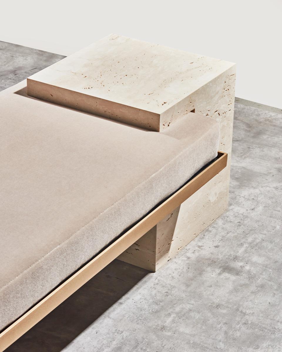 The coexist bench uses balance and delicate harmony of materials meeting. The bench consists of a brushed brass frame, honed Travertine stone cubes, and mattress upholstered in mohair fabric or COM. 

The pieces fit together seamlessly, with the