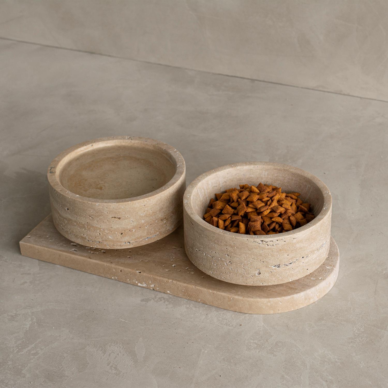 Unique and Stunning Pet bowl made of travertine stone. Expertly crafted and finished by hand, our travertine bowls are a study in sculptural simplicity. Natural variations in the stone's distinctive veining, tonal hues and organic texture reveal the