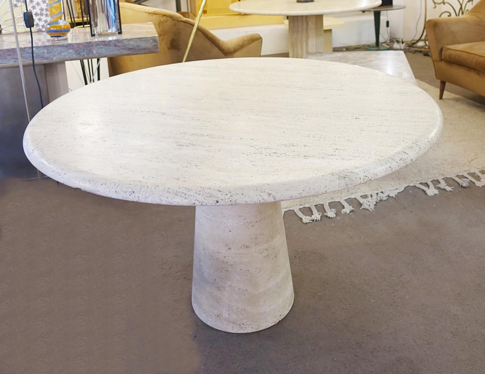 Travertine circular dining table in the style mangiarotti.
