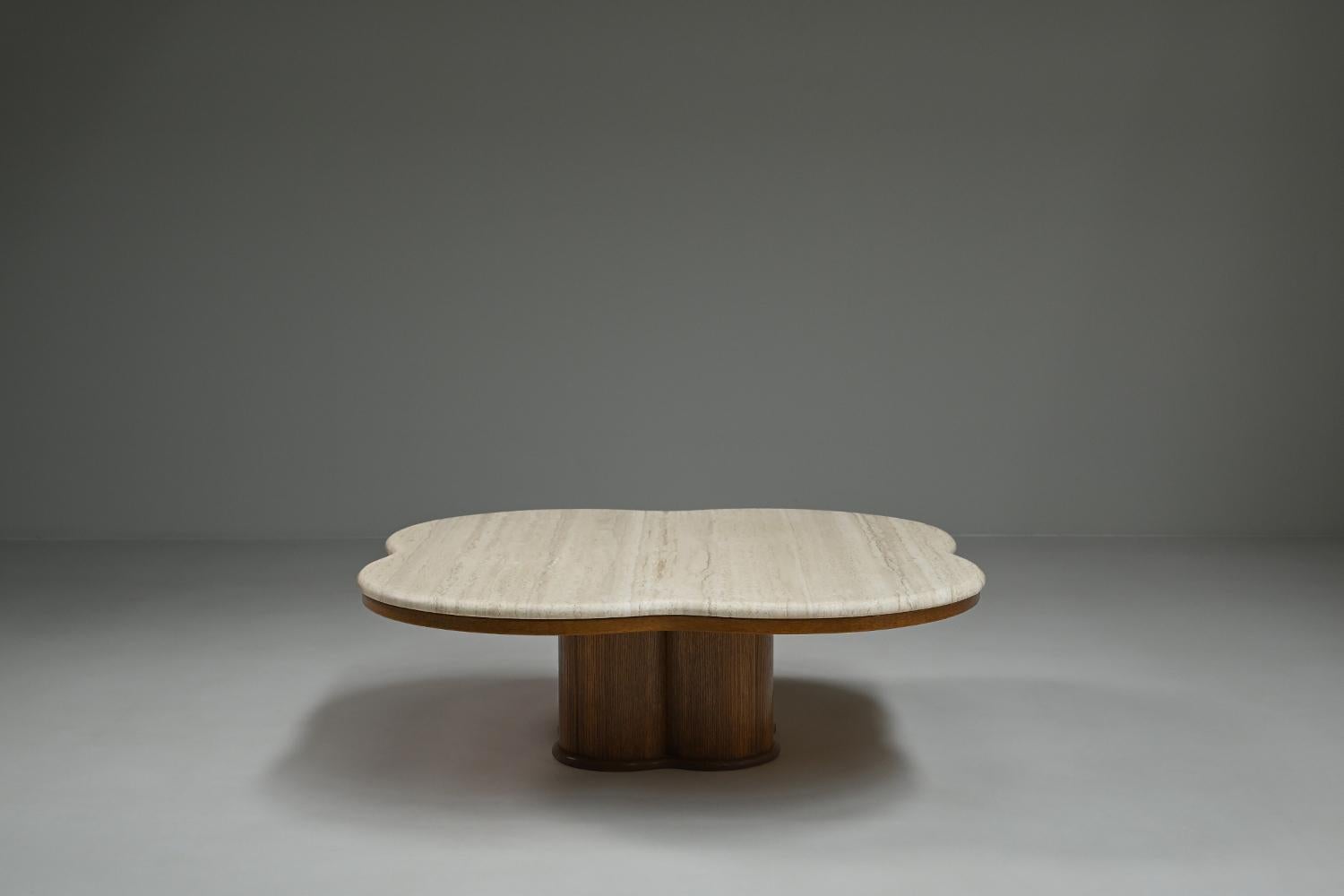Travertine clover coffee table, 1970s Italy. This coffee table features a sculptural clover-shaped design, combining natural elegance with bold craftsmanship. The tabletop is made of solid travertine, showcasing its subtle textures and warm tones.