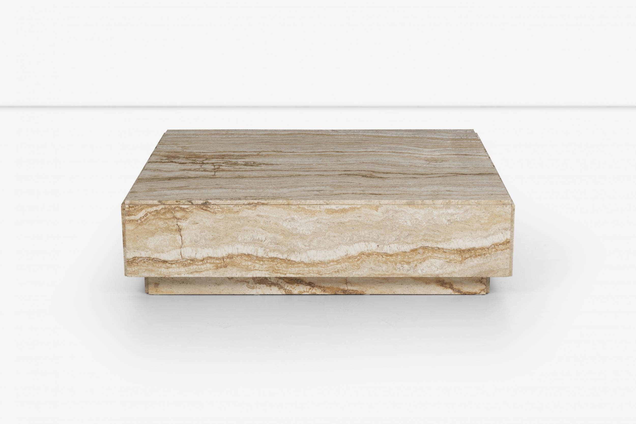 Travertine coffee table in the style of Milo Baughman, comprised of textural banded variations of layers, plinth base.
Stamper on underside [MADE IN ITALY].