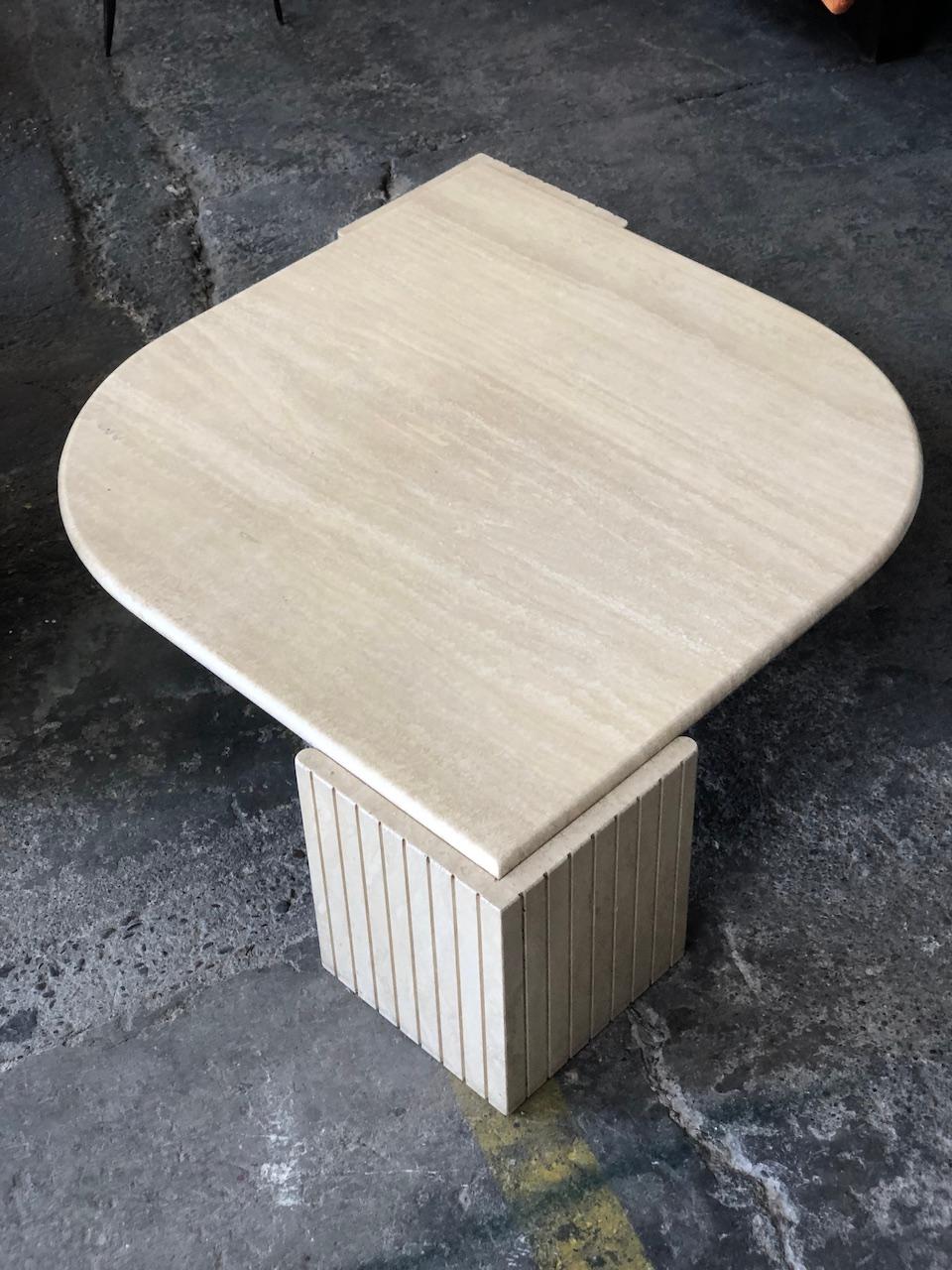 Roche Bobois 1970 travertine coffee table in the shape of an eye. The top rests on 2 independent legs.
In a perfect condition 
Tray 3cm.