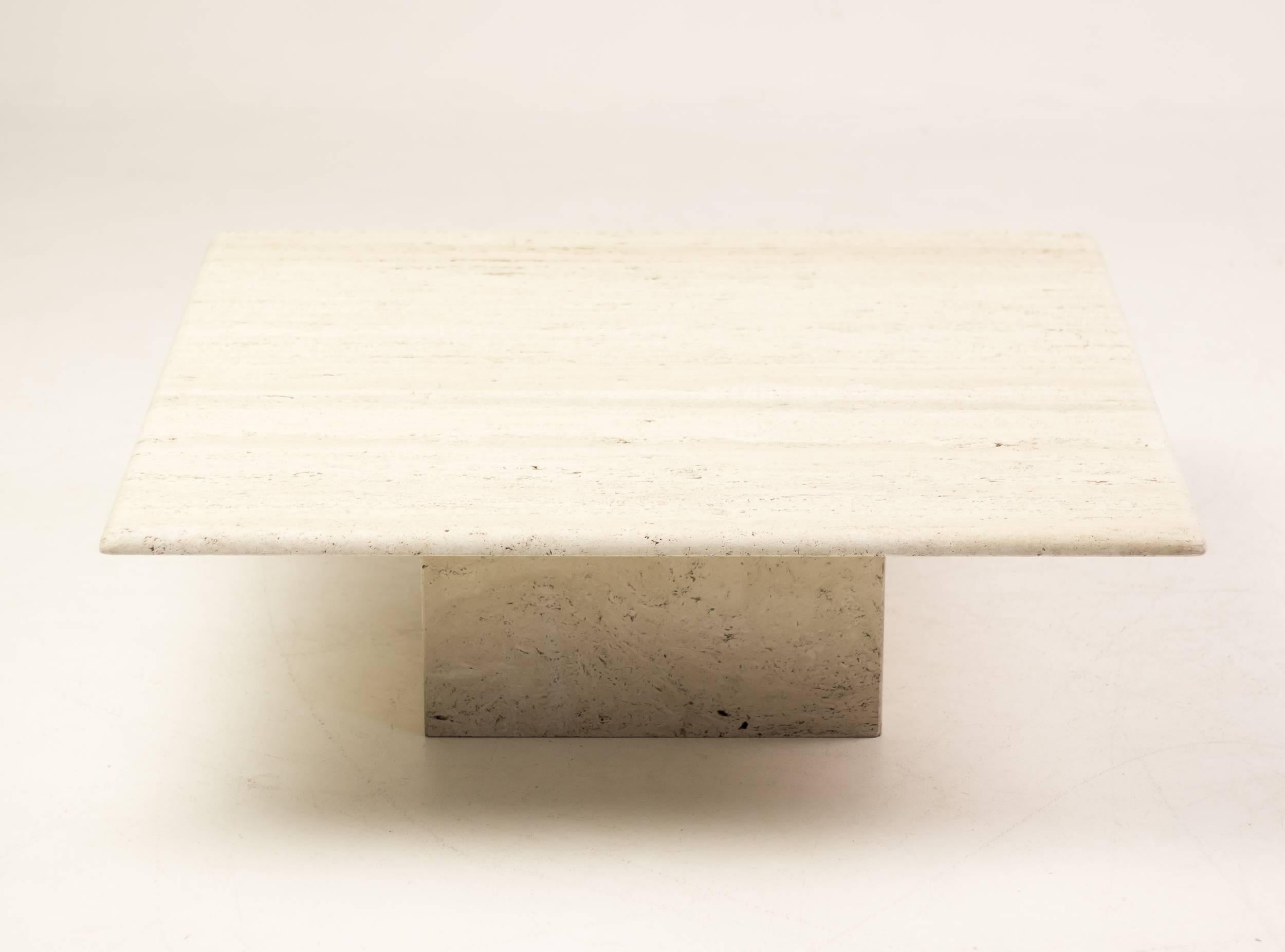 This architectural Up&Up travertine coffee table has a square travertine base that supports a top with trademark Mangiarotti bullnose edge. The travertine has a rich grain and the proportions are beautiful.


 
