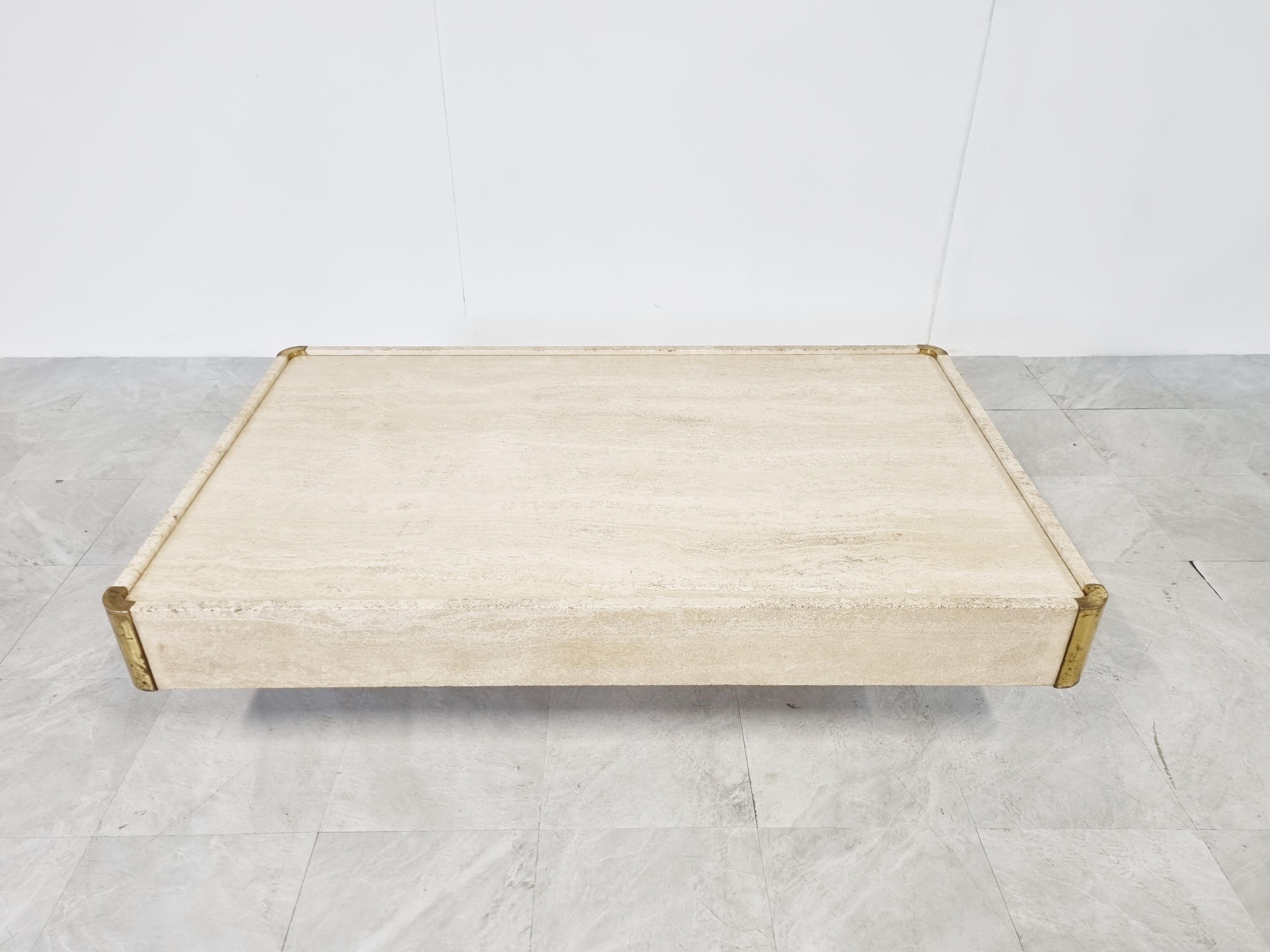Polished travertine coffee table by Willy Rizzo with a central travertine base and brass rounded corners.

Good condition with some nice patina on the brass edges

1970s - Belgium

Dimensions
Height: 35cm/1377