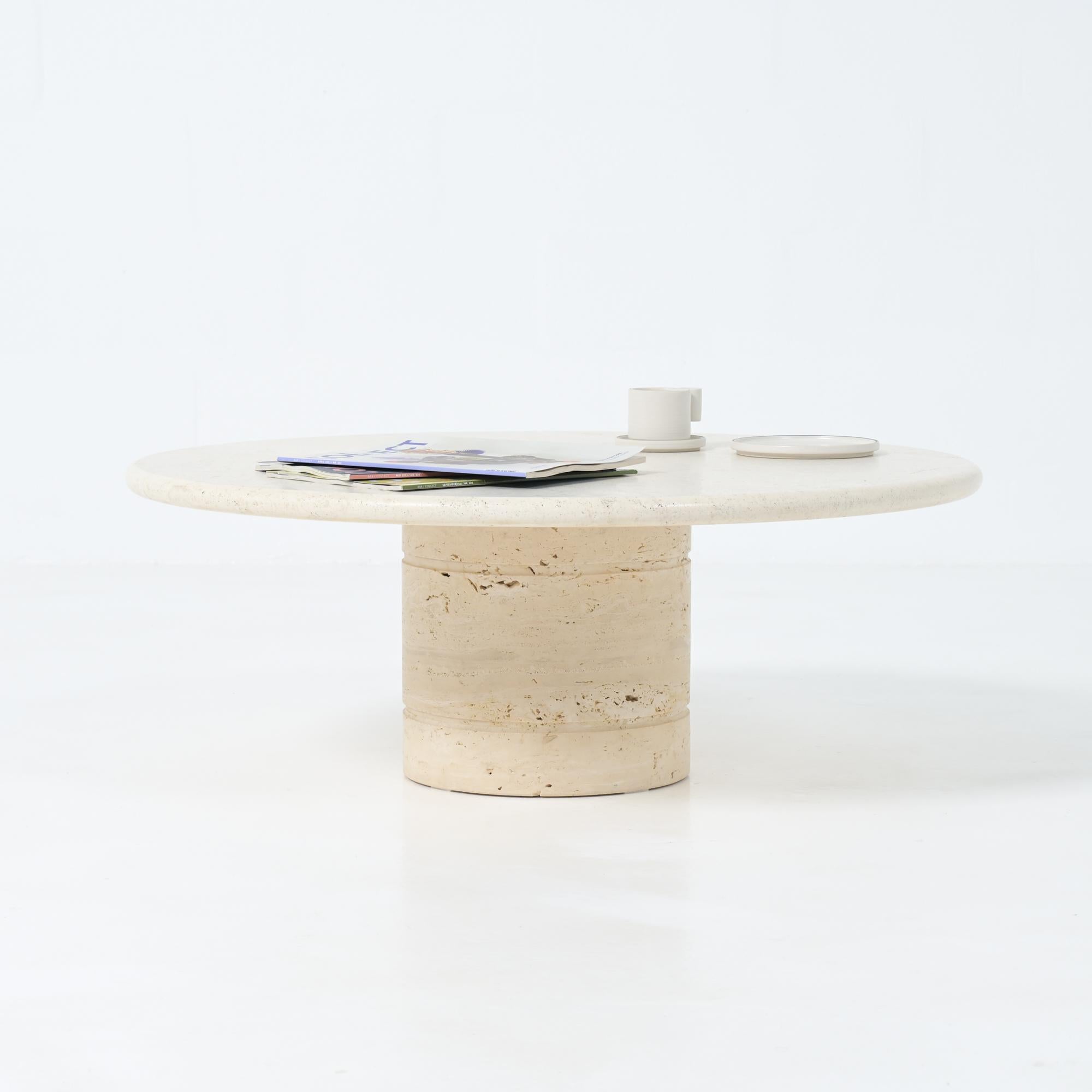 This travertine table was made in the style of Angelo Mangiarotti for Up & Up.
It can be dated back to the 1970s.

This piece is still in good vintage condition.