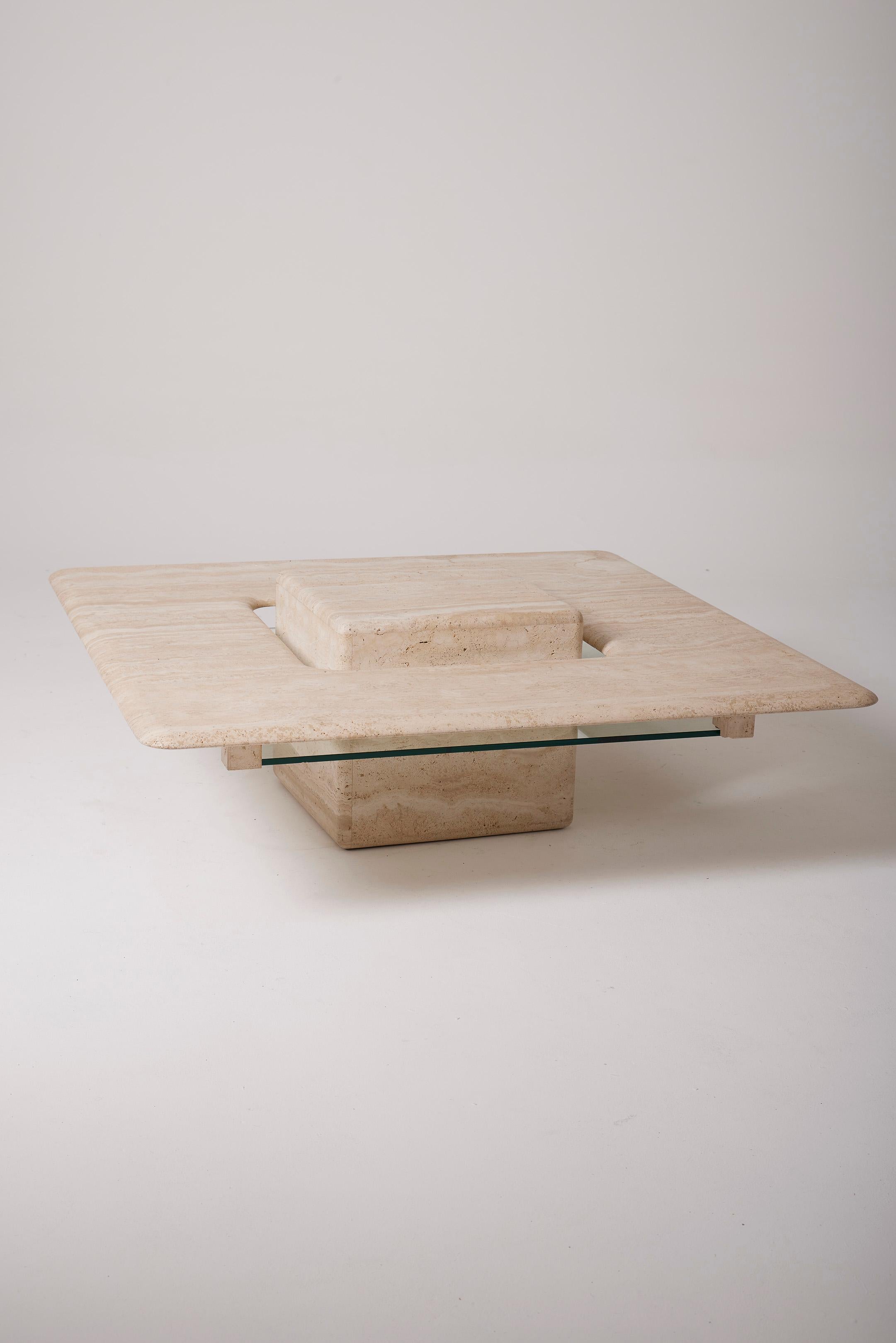 Square travertine and glass coffee table from the 1970s. Excellent condition.
LP3055