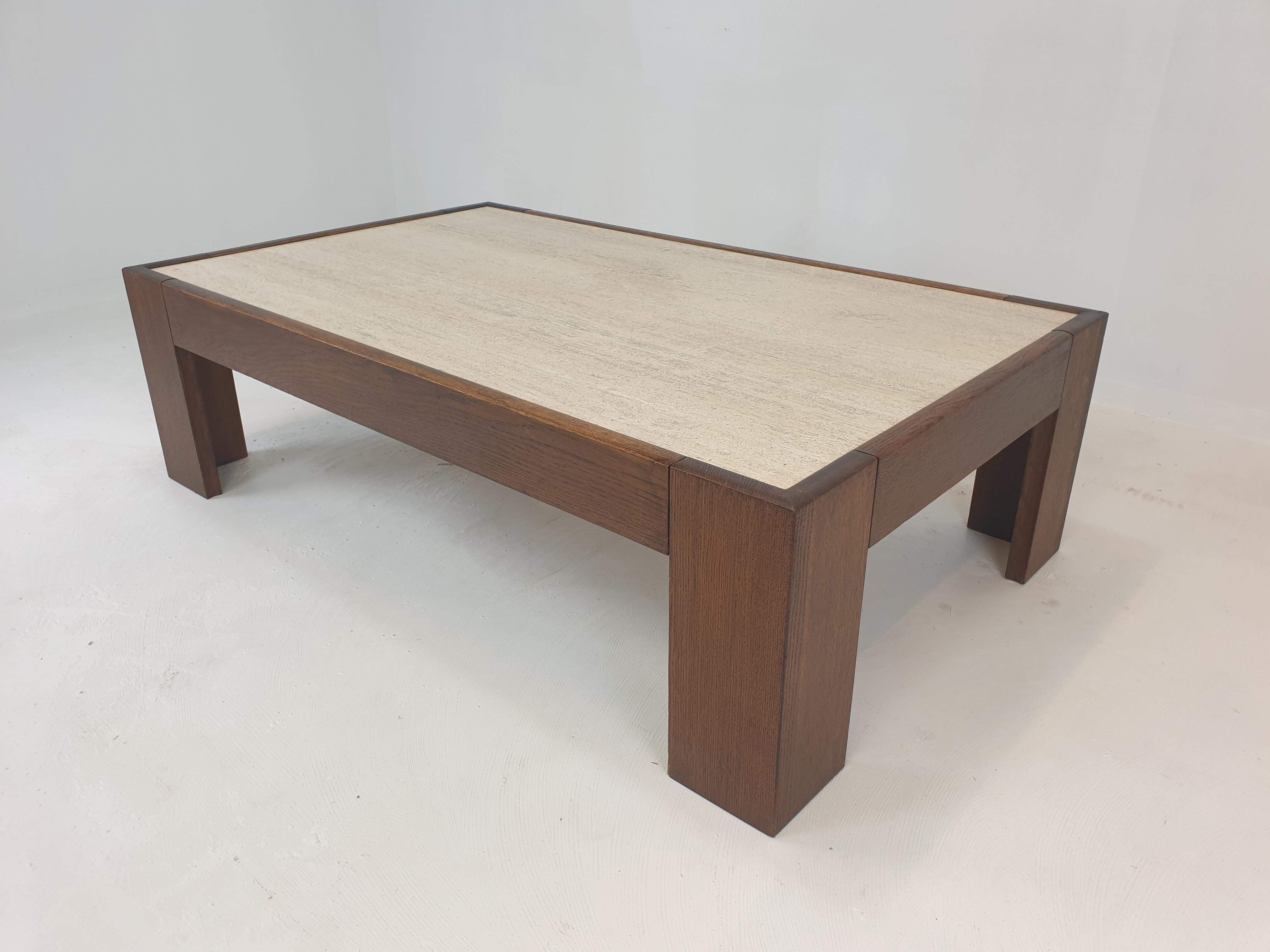 Very nice custom made coffee table from the 70's.
Fabricated in Belgium.

The solid frame is made of oak, it makes a stunning combination with the beautiful travertine plate.

We ship worldwide and we work with professional shippers and packers.