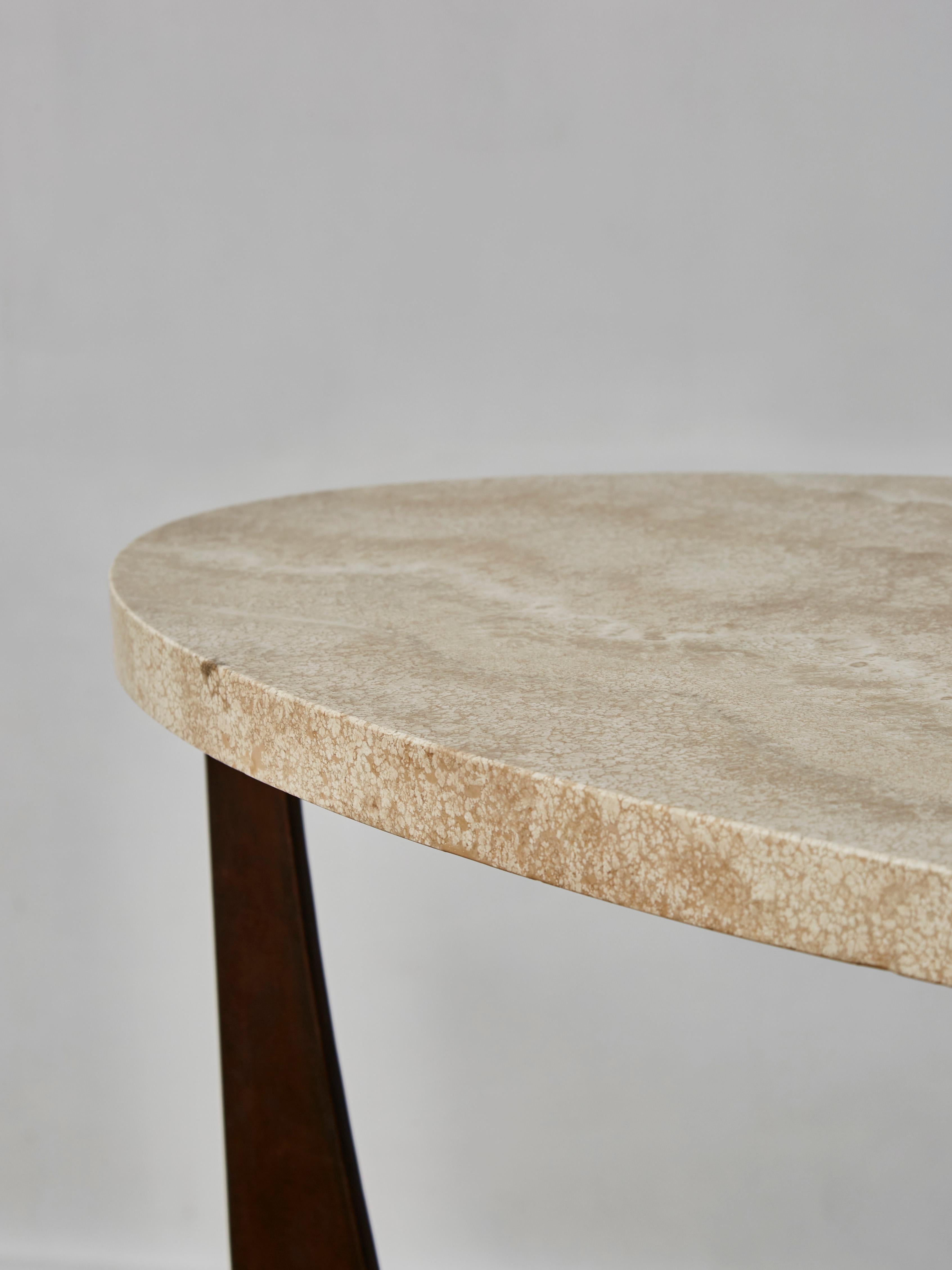 Elegant brutalist console in patinated steel and oval travertine stone top.
Creation by Studio Glustin.
Pair available.