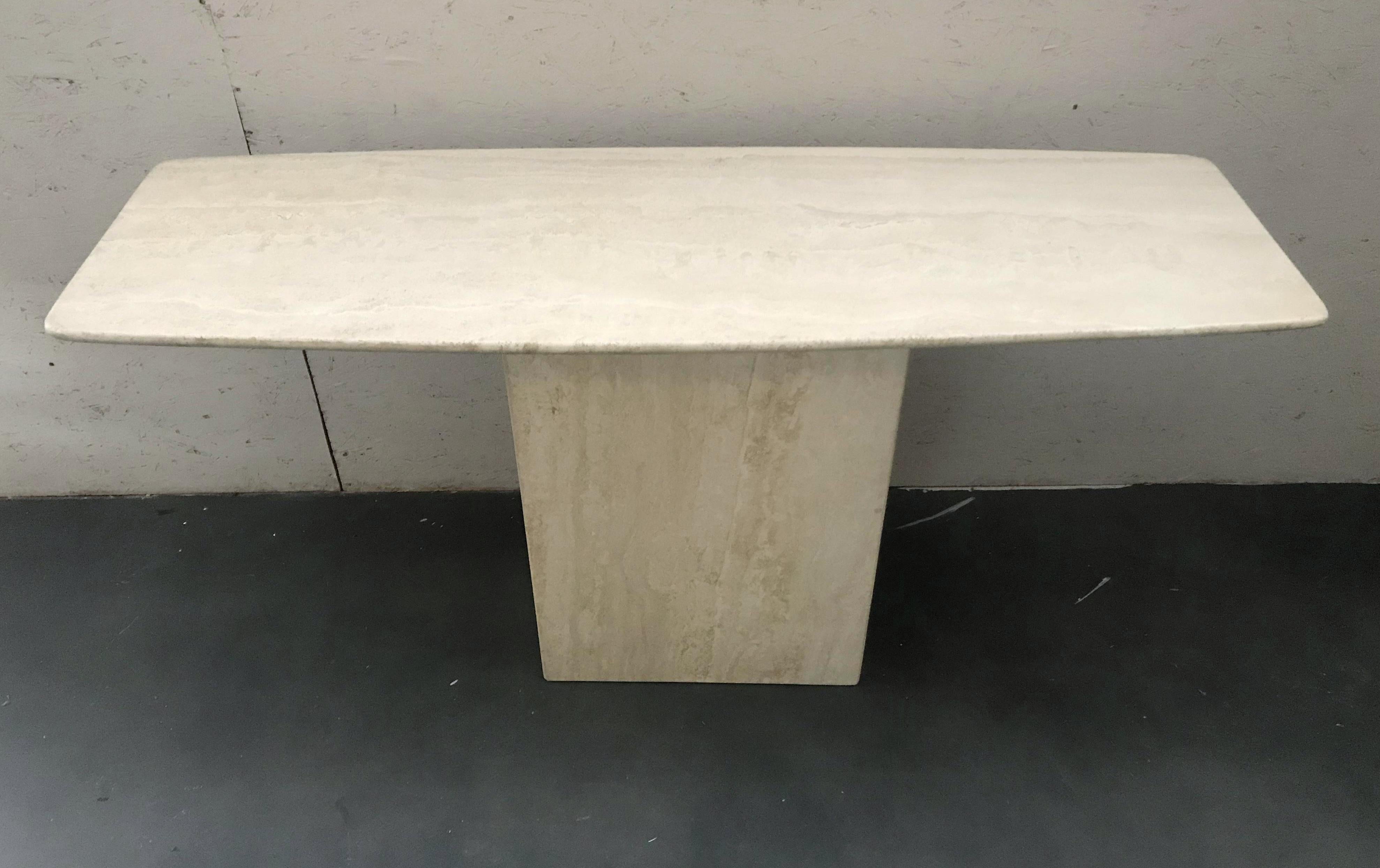 Vintage midcentury travertine limestone console table with rounded rectangular top supported by a single pedestal base / Made in Italy, circa 1970s
Measures: Width 59 inches, depth 19.5 inches, height 29 inches
1 available in stock in Palm Springs