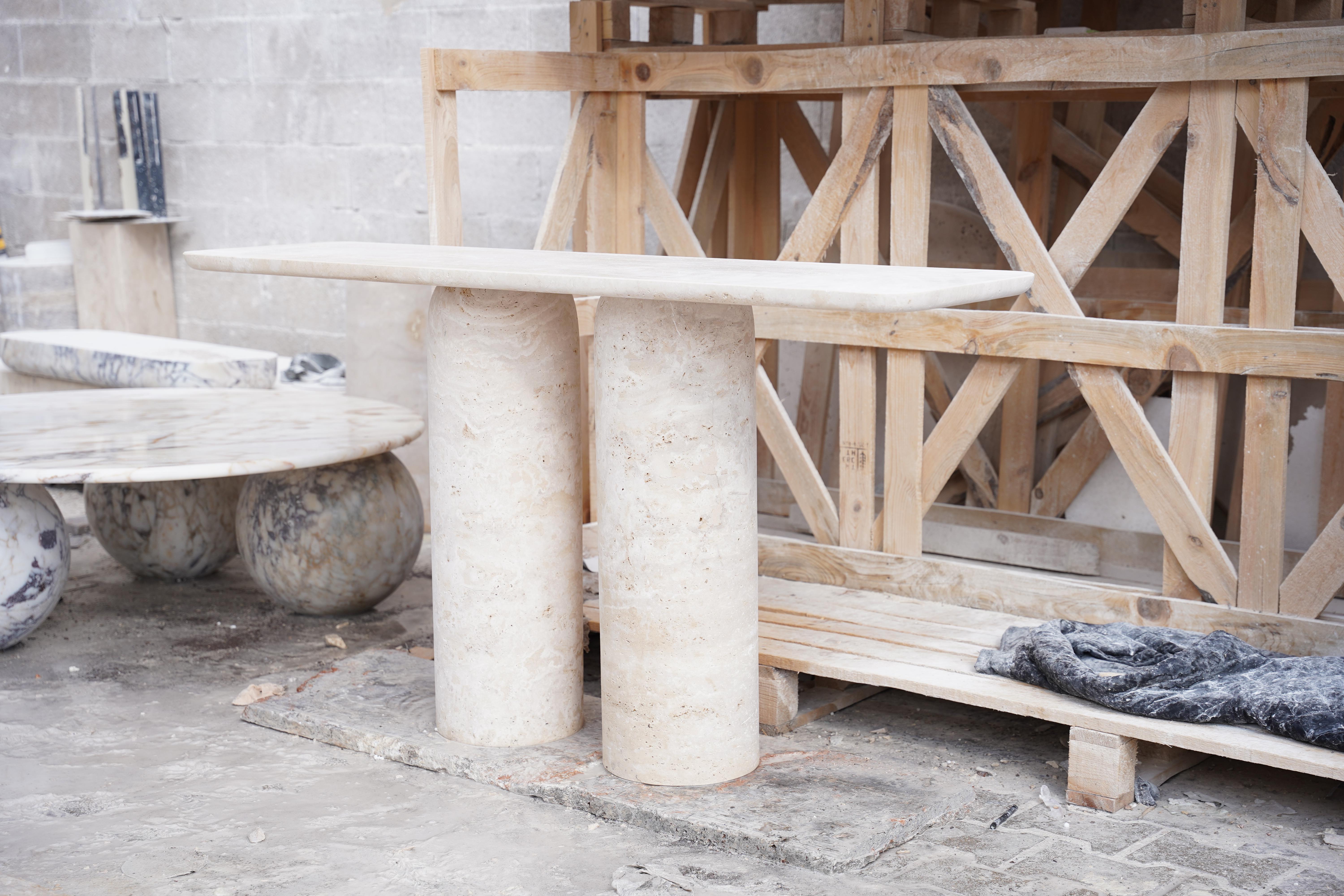 rh travertine console