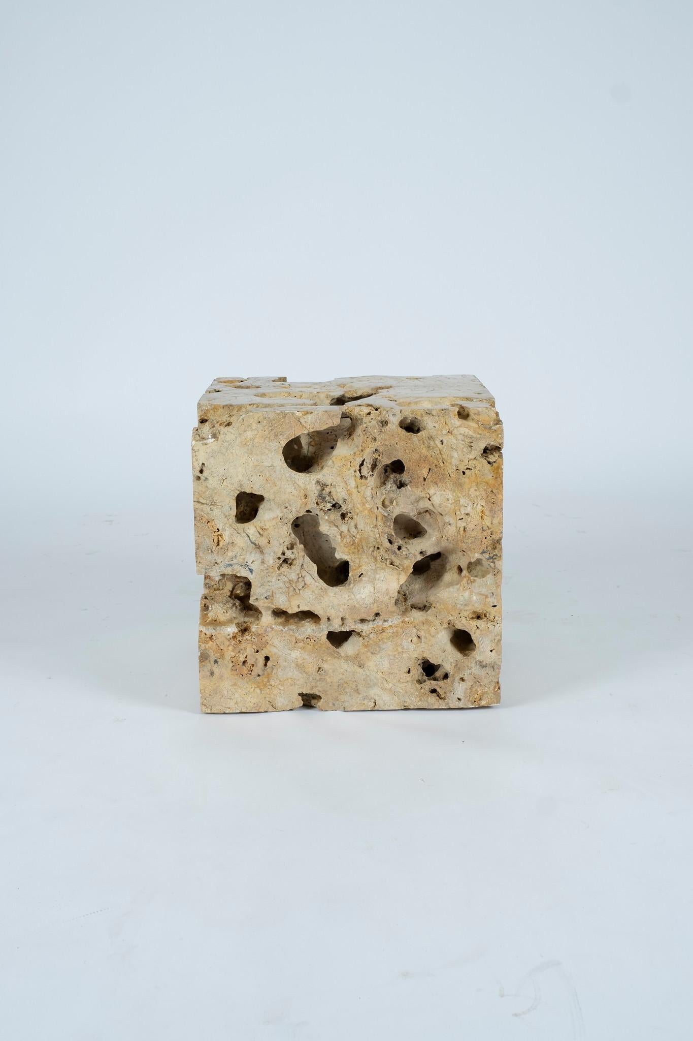 Travertine cube table block with large cavernous pores.