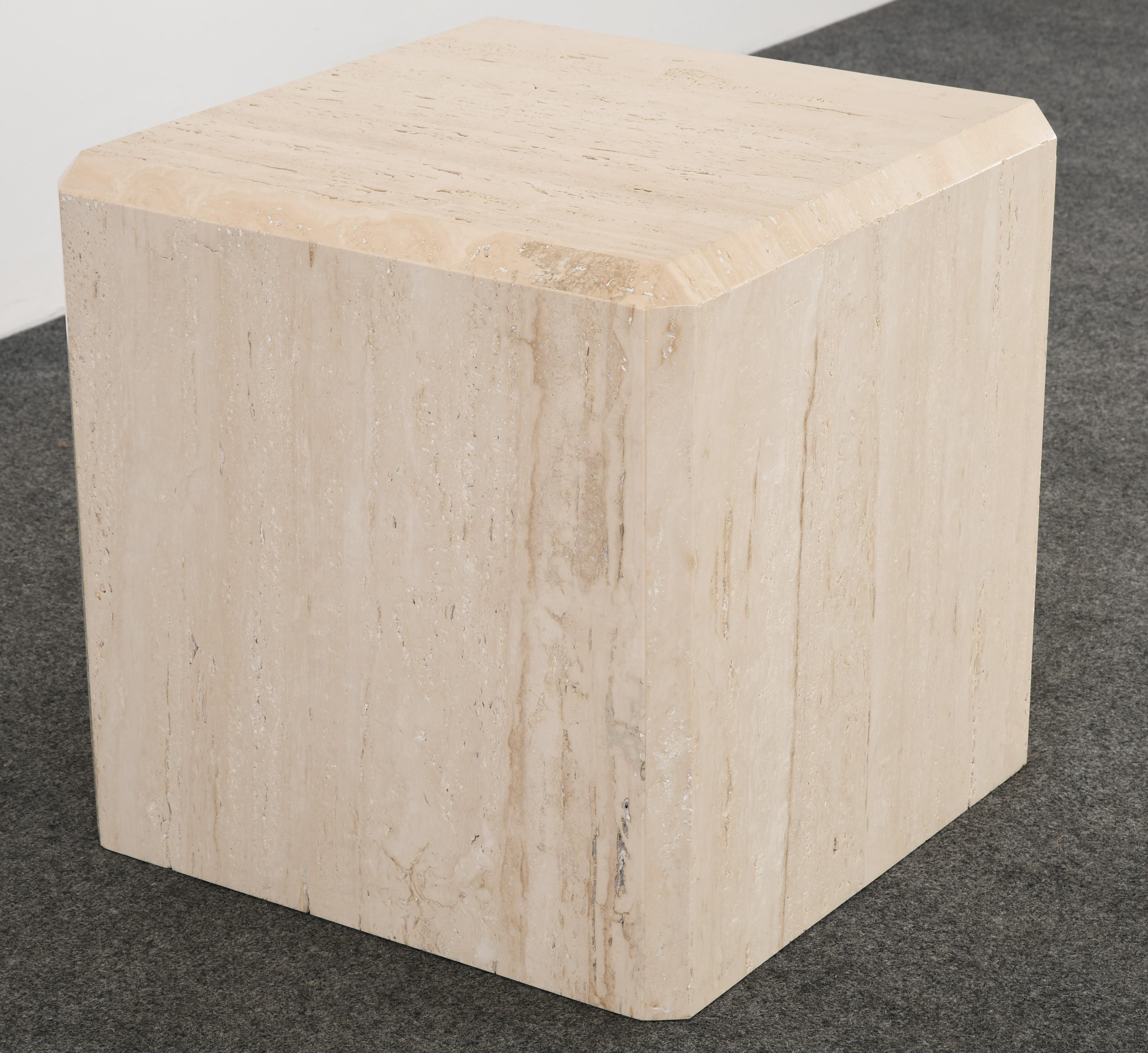 A minimalist travertine cube table in the manner of Kreiss with beveled edge top. This beautiful travertine table would look great in a modern or contemporary setting. Very elegant and simple design. Structurally sound with age-appropriate wear.