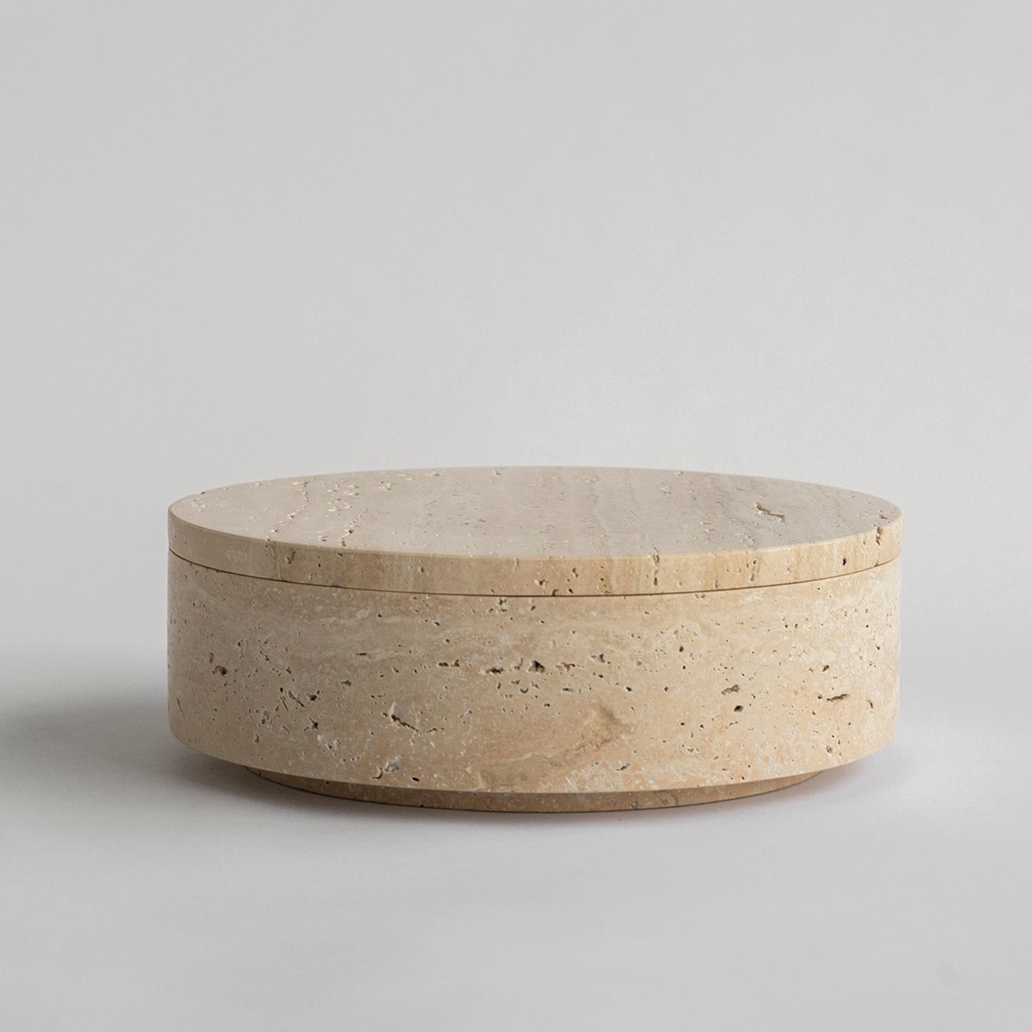 Stunning, aesthetic, timeless are words that can be used to describe this elegant and modern travertine bowl from Kiwano. Expertly crafted and finished by hand, our travertine vases are a study in sculptural simplicity. Natural variations in the