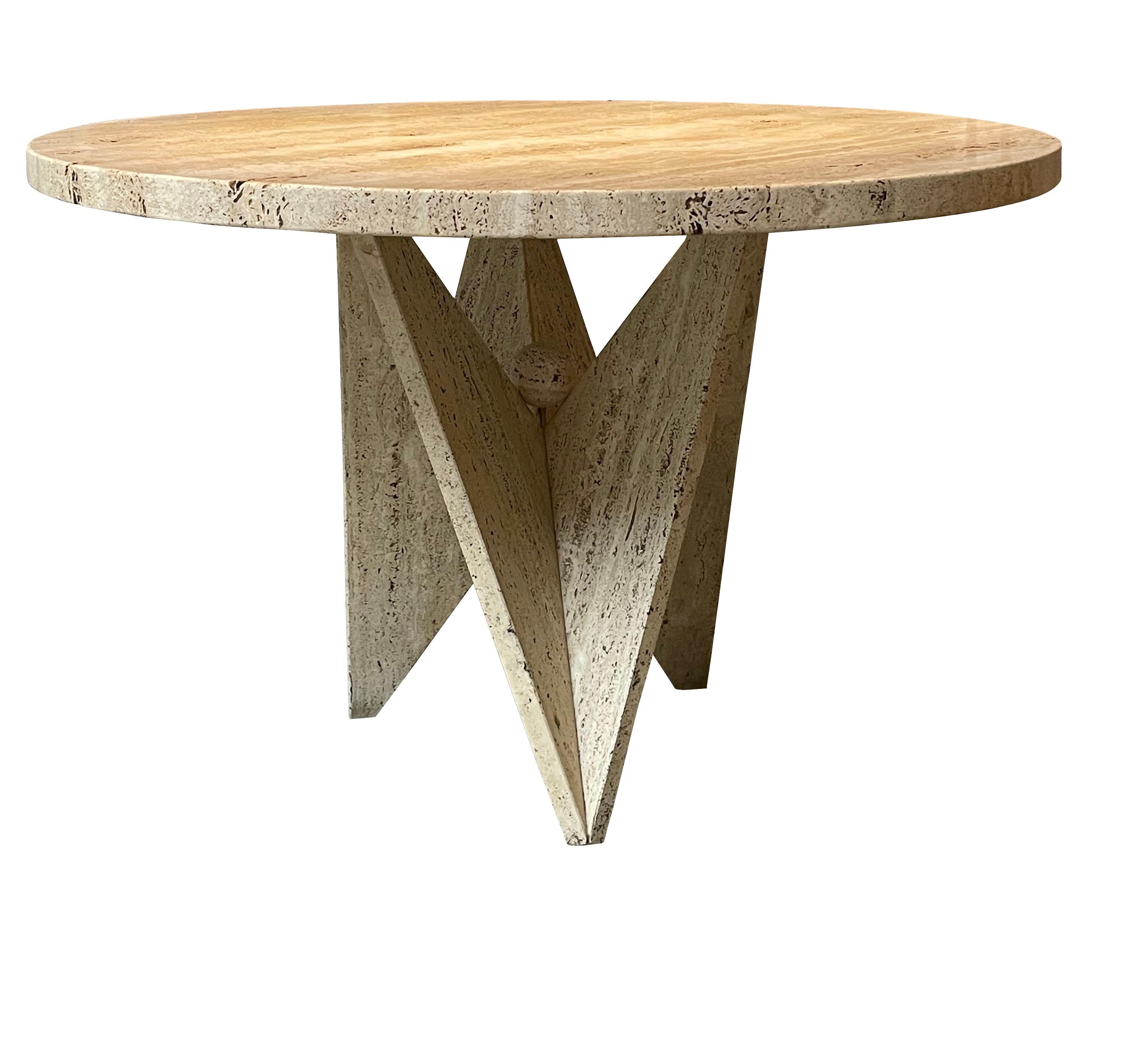 1970s Spanish round top honed and unfilled travertine table.
Can be used as a dining or a center hall table.
Geometric V shape base with a decorative ball at the center.
ARRIVING NOVEMBER.