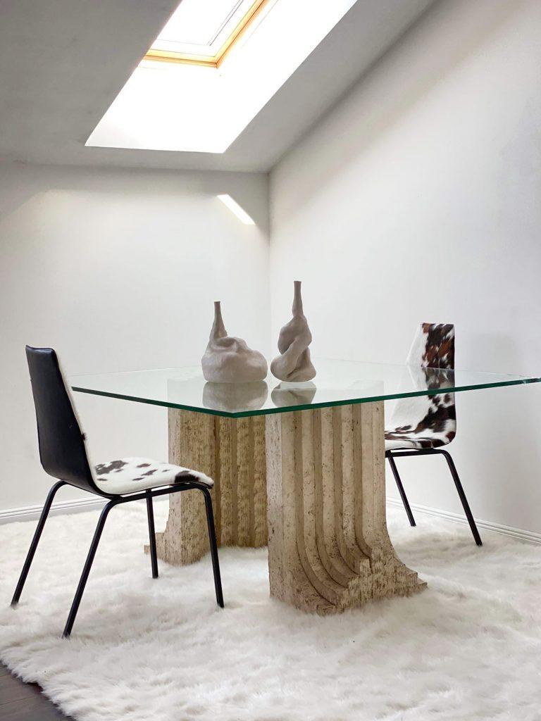 Italian travertine dining table base. Sold without glass.

A sculptural dining table base made from travertine is a truly stunning and unique piece of furniture. Travertine is a type of limestone that has a light, creamy colour and distinctive